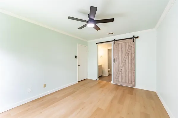 a view of a room with a ceiling fan