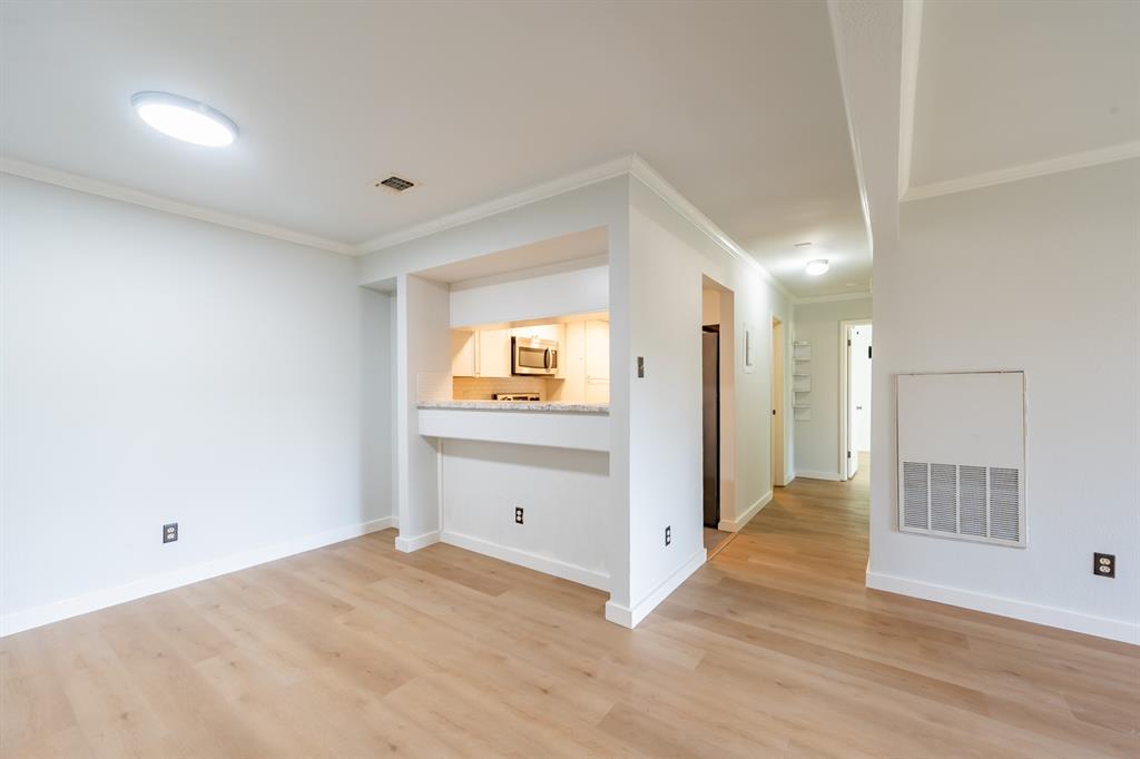 8600 Fathom Circle, Unit 1407 Austin, TX 78750 - Photo 2 of 26 a view of empty room with wooden floor
