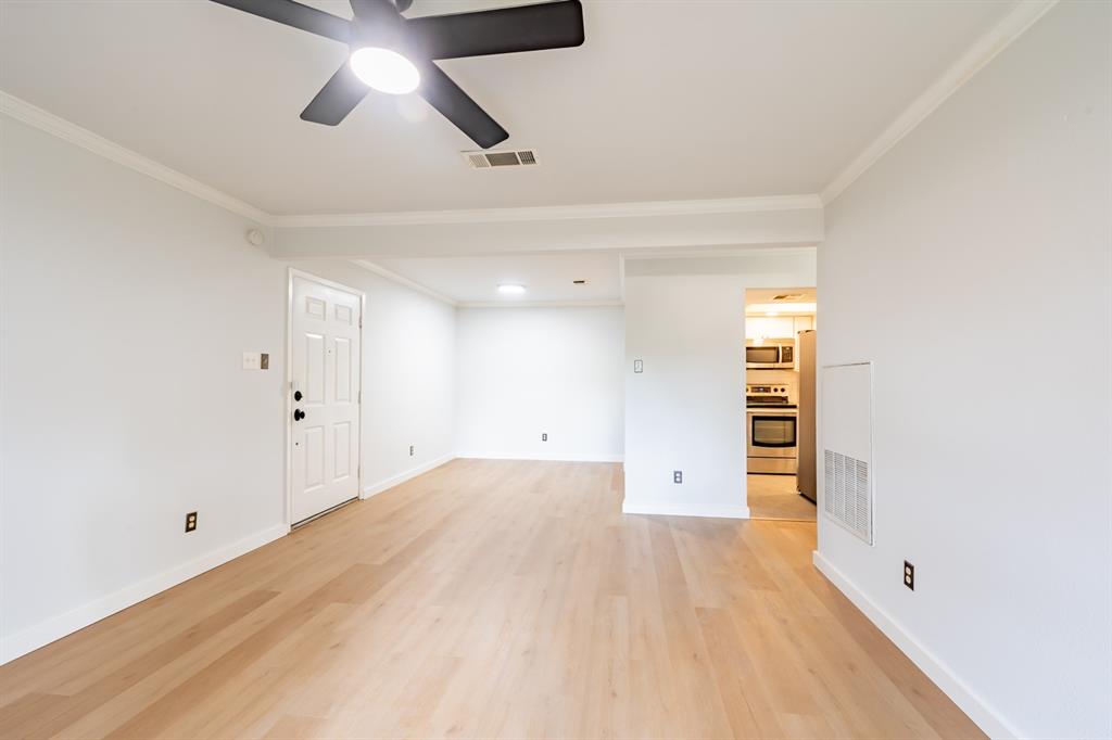 8600 Fathom Circle, Unit 1407 Austin, TX 78750 - Photo 4 of 26 wooden floor in an empty room