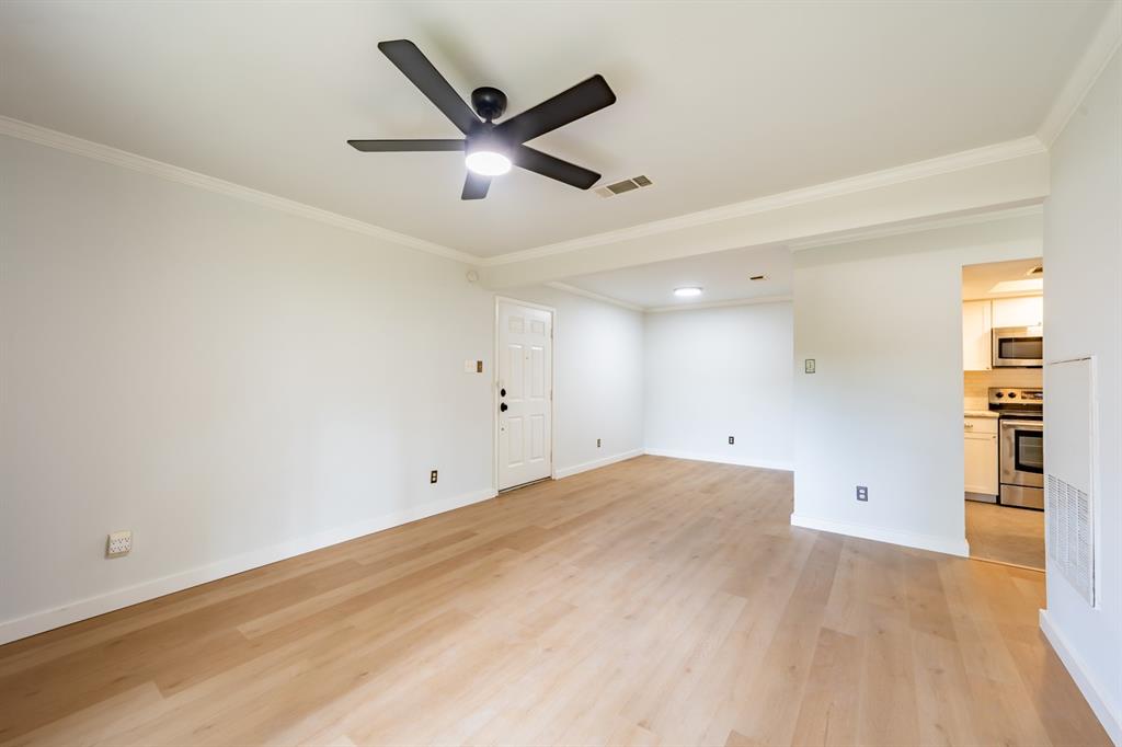 8600 Fathom Circle, Unit 1407 Austin, TX 78750 - Photo 5 of 26 an empty room with a empty space and wooden floor
