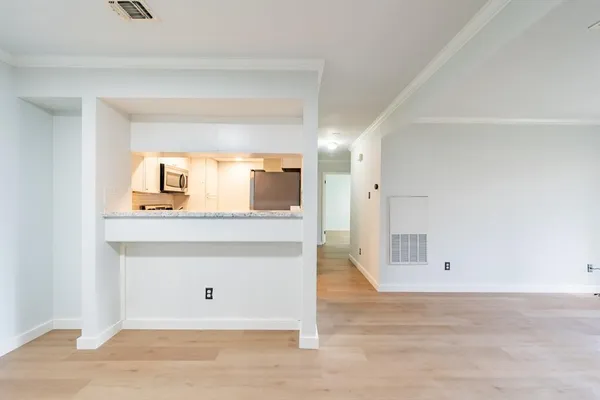 a view of a hallway to a room