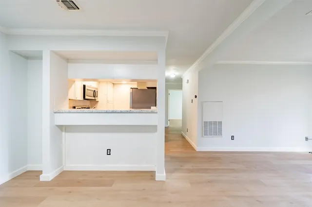 a view of a hallway to a room