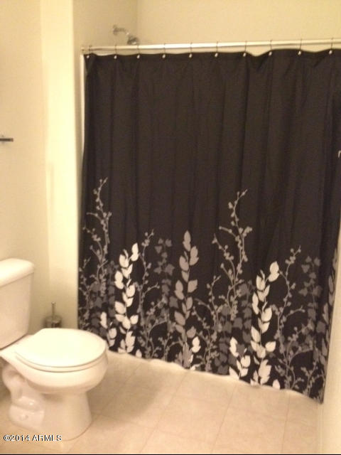 1250 South Rialto, Unit 62 Mesa, AZ 85209 - Photo 17 of 24 a bathroom with a toilet
