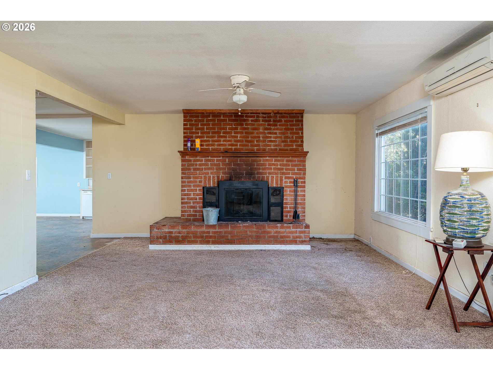 32404 Southeast Pipeline Road Gresham, OR 97080 - Photo 11 of 48 a living room with furniture a fireplace and a table