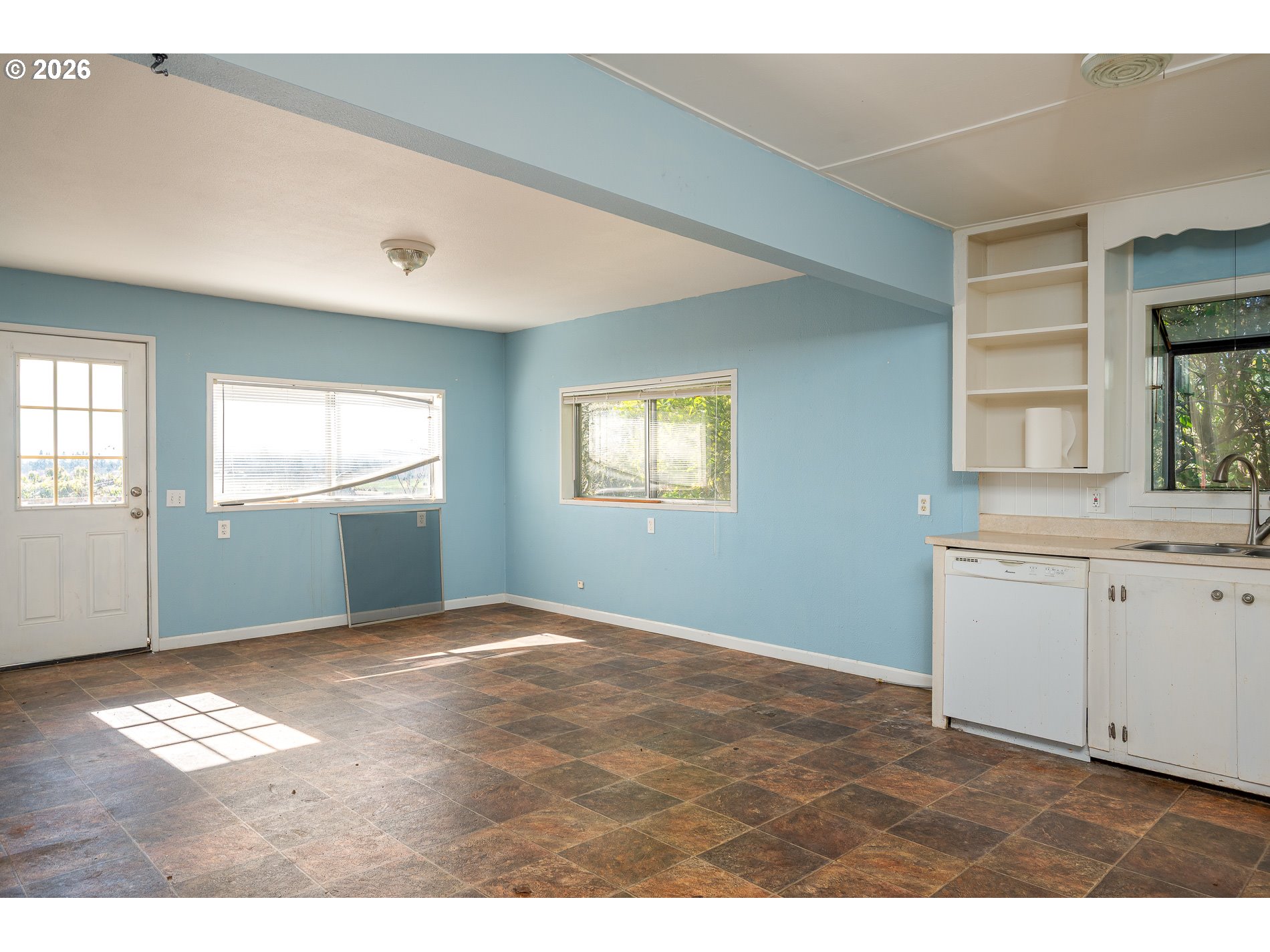 32404 Southeast Pipeline Road Gresham, OR 97080 - Photo 16 of 48 a view of an empty room with window and wooden floor