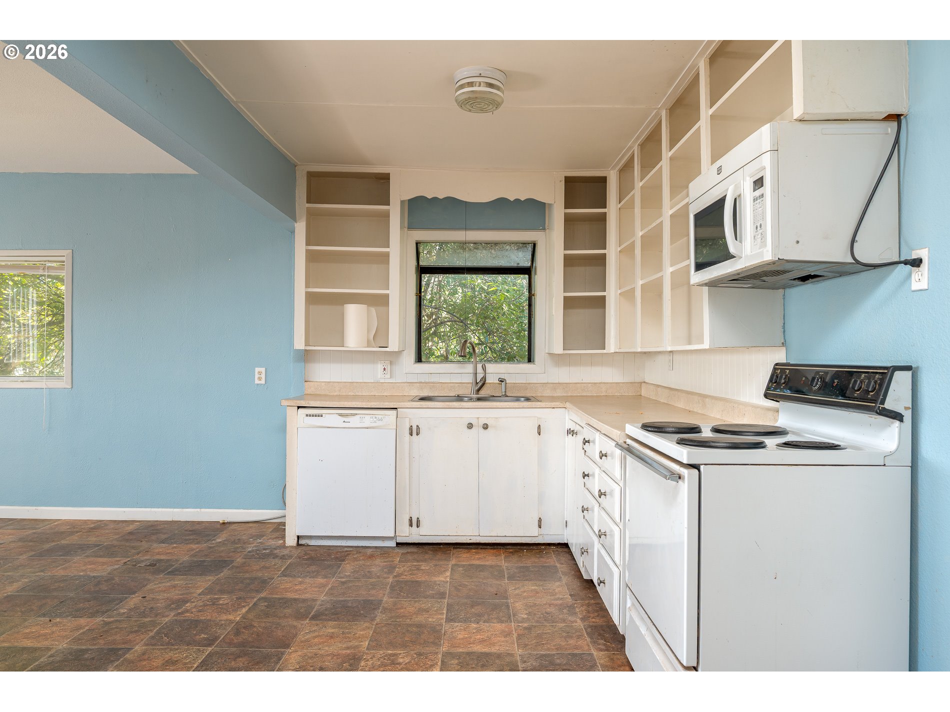 32404 Southeast Pipeline Road Gresham, OR 97080 - Photo 17 of 48 a kitchen with a stove a sink and a window