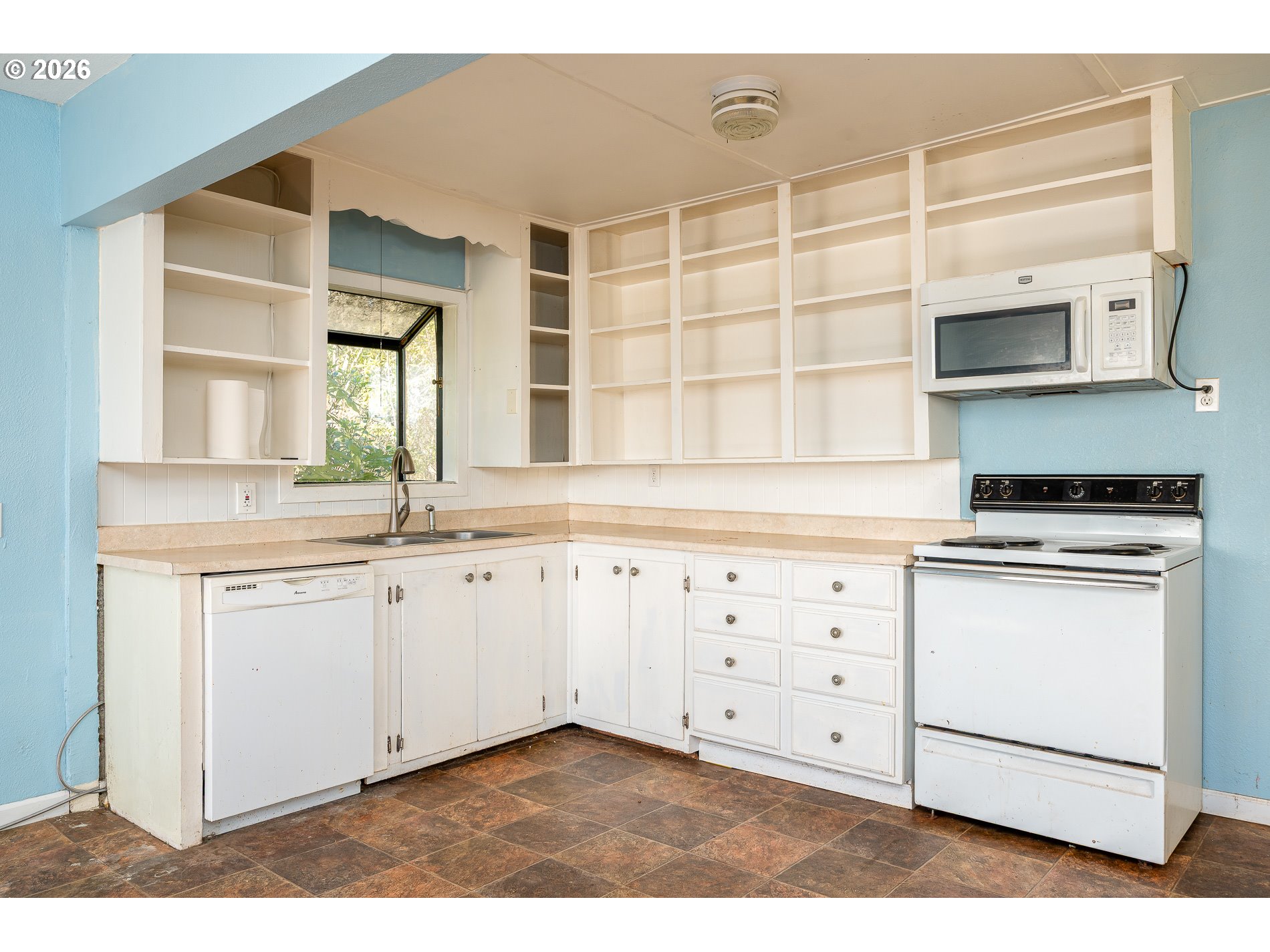 32404 Southeast Pipeline Road Gresham, OR 97080 - Photo 20 of 48 a kitchen with granite countertop white cabinets and white appliances