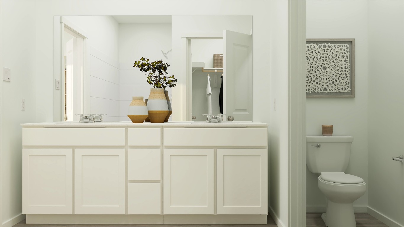 17911 Prairie Falcon Way, Unit 3 Pflugerville, TX 78660 - Photo 18 of 24 a bathroom with a toilet sink and mirror