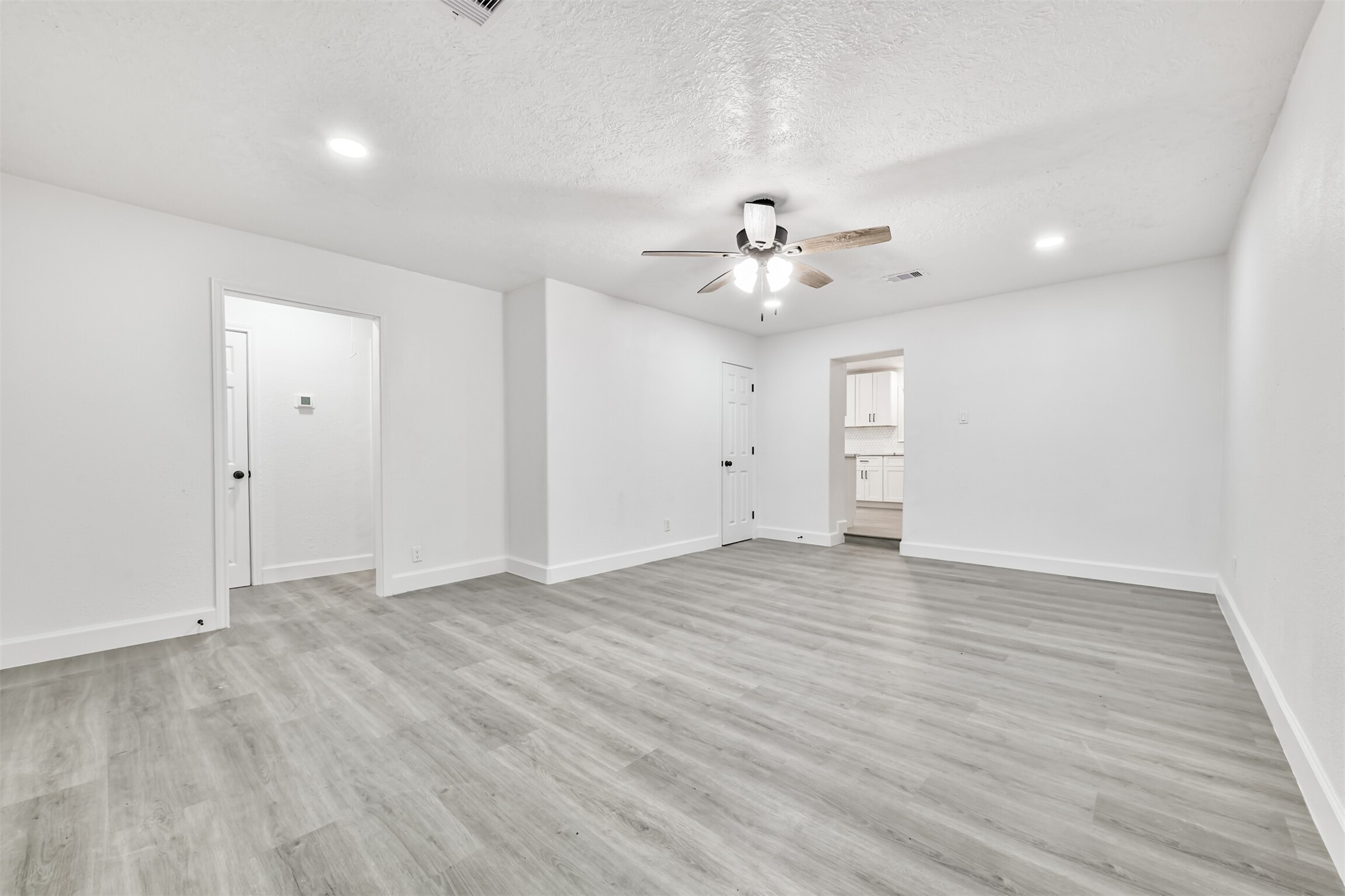 2121 County Road 892 Alvin, TX 77511 - Photo 3 of 24 Plenty of space with wood laminate flooring