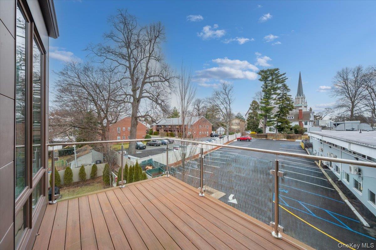 422 East Boston Post Road, Unit 303 Mamaroneck, NY 10543 - Photo 20 of 23 a view of balcony and deck with wooden floor and outdoor space
