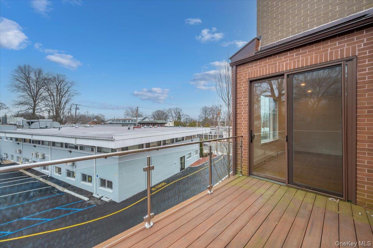 422 East Boston Post Road, Unit 303 Mamaroneck, NY 10543 - Photo 21 of 23 a spacious bathroom with a granite countertop sink and a mirror