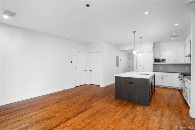 a view of kitchen with wooden floor