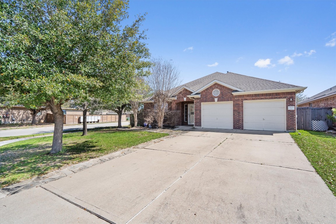 11605 Sun Glide Lane Manor, TX 78653 - Photo 1 of 1 a view of house with a yard and potted plants