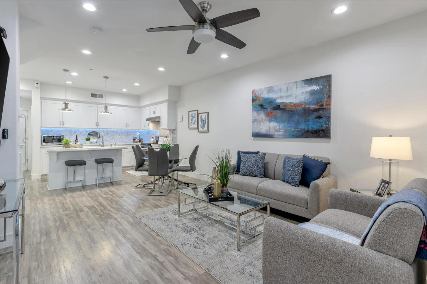 37544 Cape Cod Road Newark, CA 94560 - Photo 1 of 1 a living room with furniture kitchen view and a wooden floor