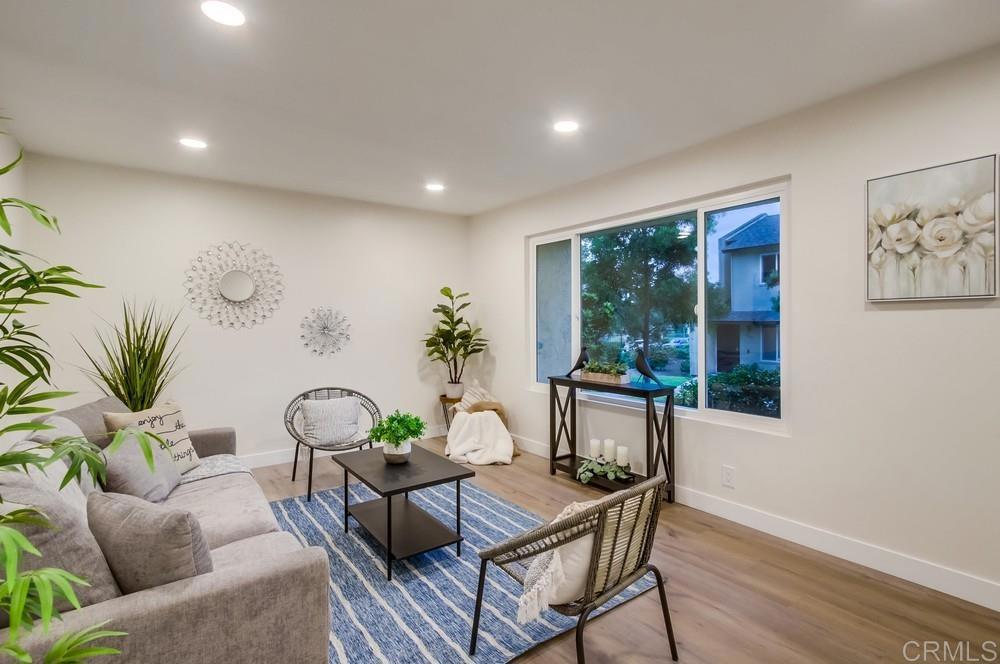 10342 Kerrigan Street Santee, CA 92071 - Photo 1 of 1 a living room with furniture and a potted plant