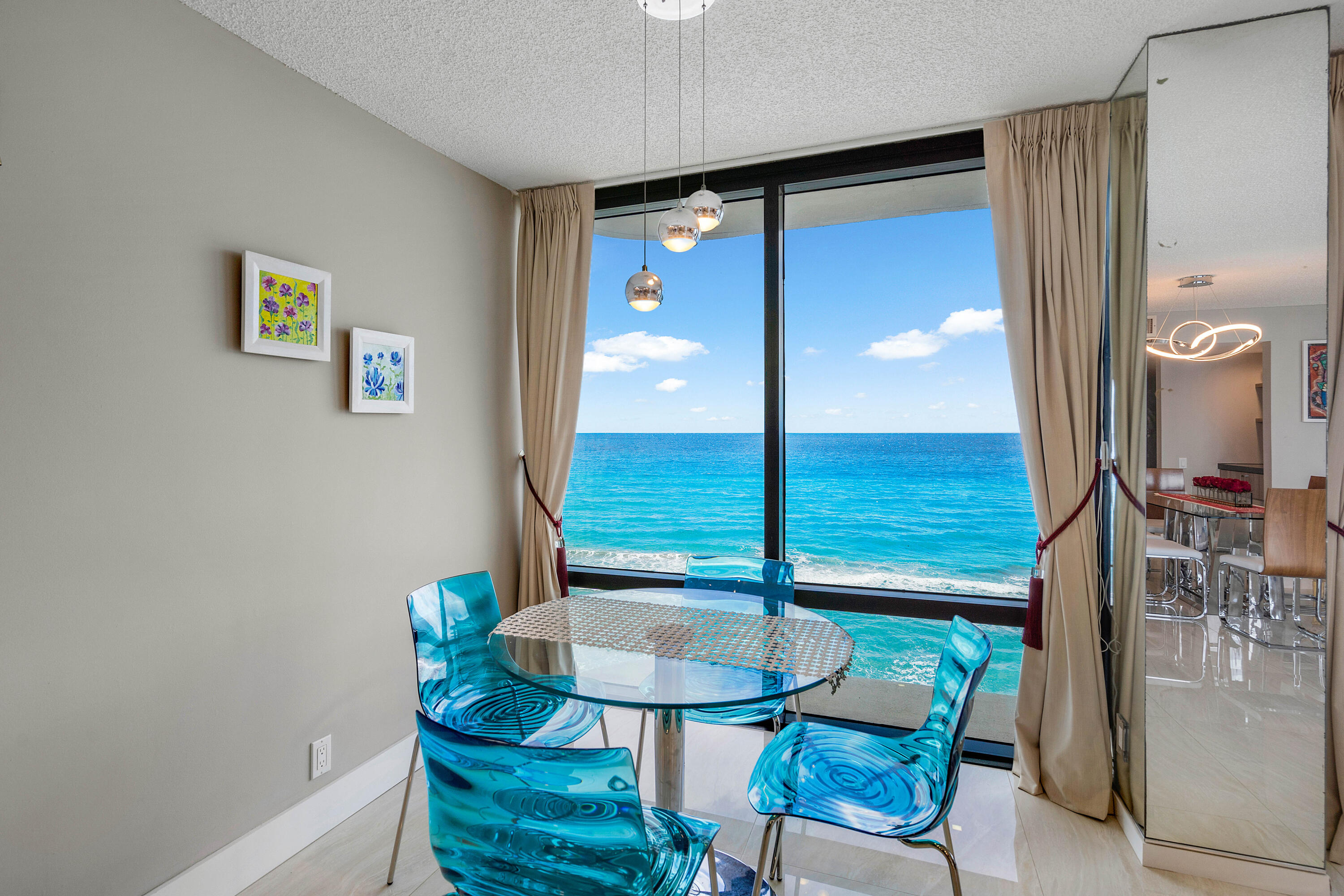 250 South Ocean Boulevard, Unit 7E Boca Raton, FL 33432 - Photo 12 of 45 a view of a dining room with furniture and a mirror