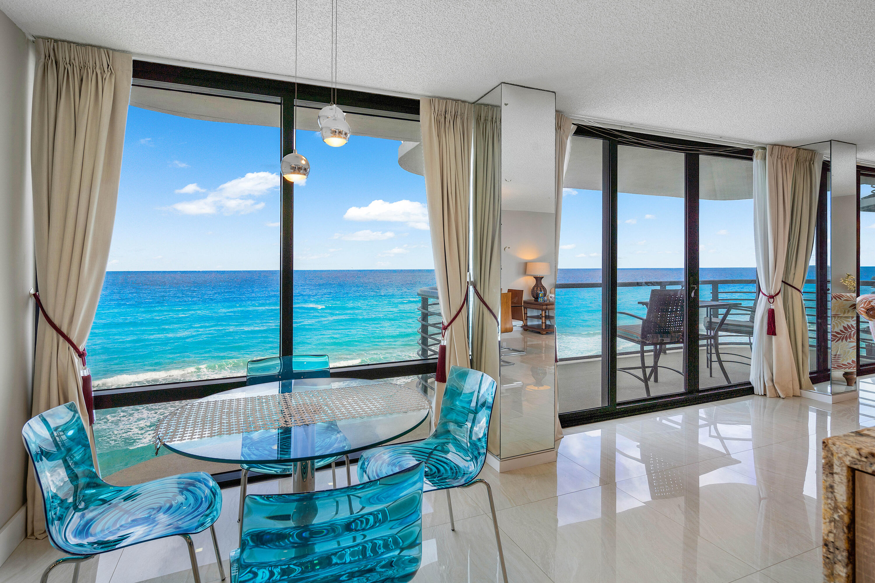 250 South Ocean Boulevard, Unit 7E Boca Raton, FL 33432 - Photo 13 of 45 a view of a living room with furniture and floor to ceiling window