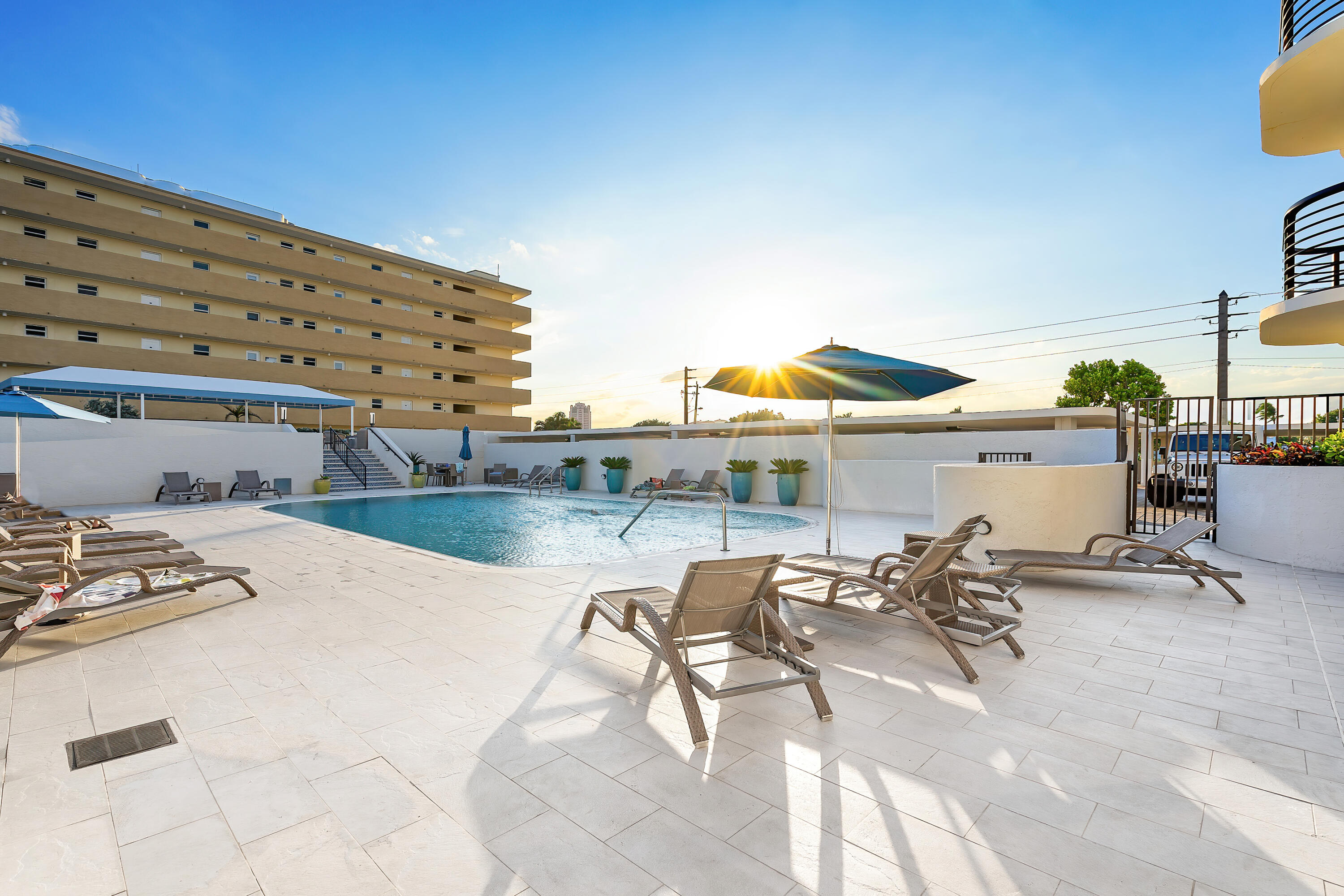 250 South Ocean Boulevard, Unit 7E Boca Raton, FL 33432 - Photo 39 of 45 a view of a swimming pool with outdoor seating