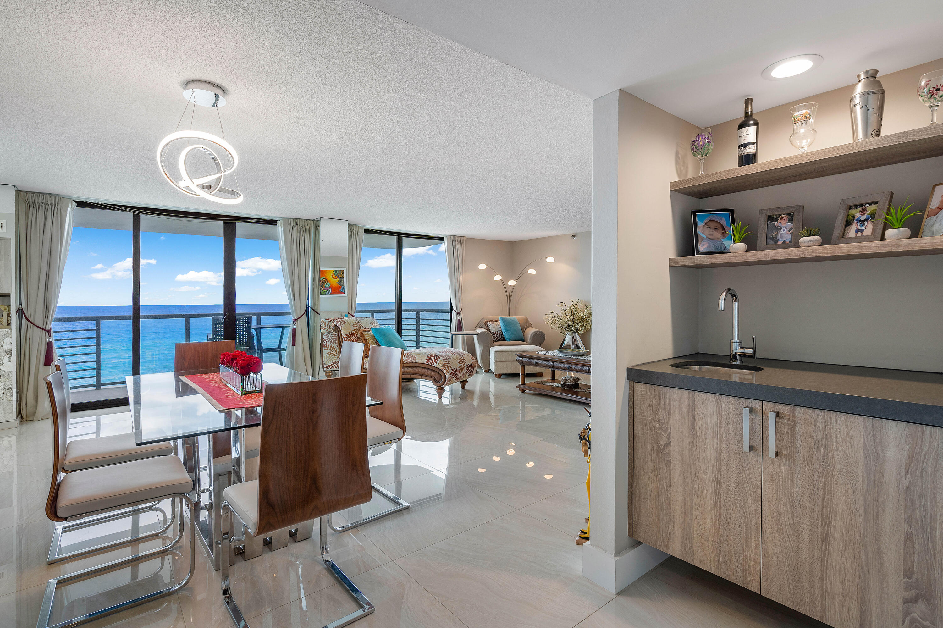 250 South Ocean Boulevard, Unit 7E Boca Raton, FL 33432 - Photo 5 of 45 a living room with furniture and a large window