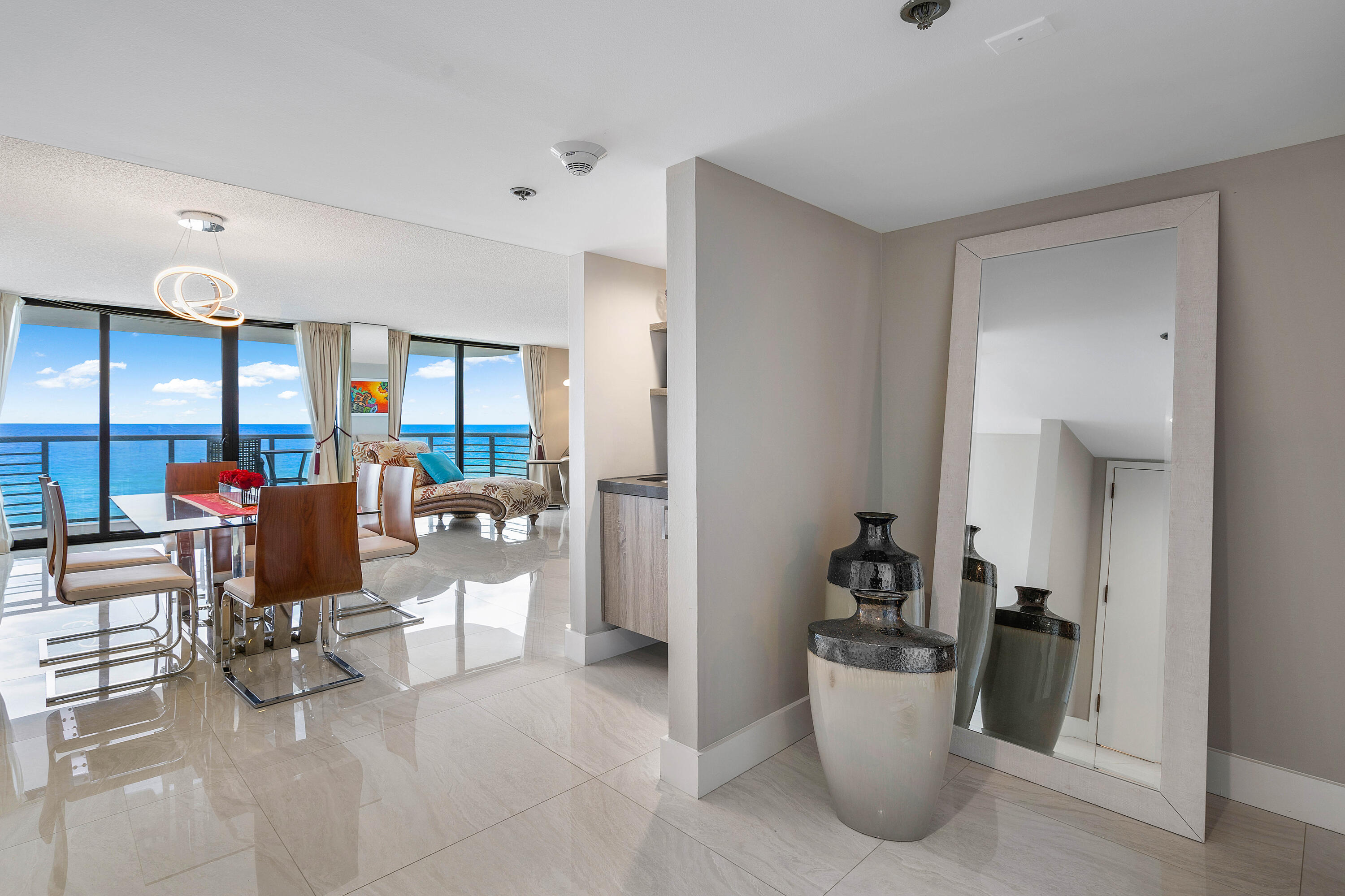 250 South Ocean Boulevard, Unit 7E Boca Raton, FL 33432 - Photo 6 of 45 a living room with furniture and white walls