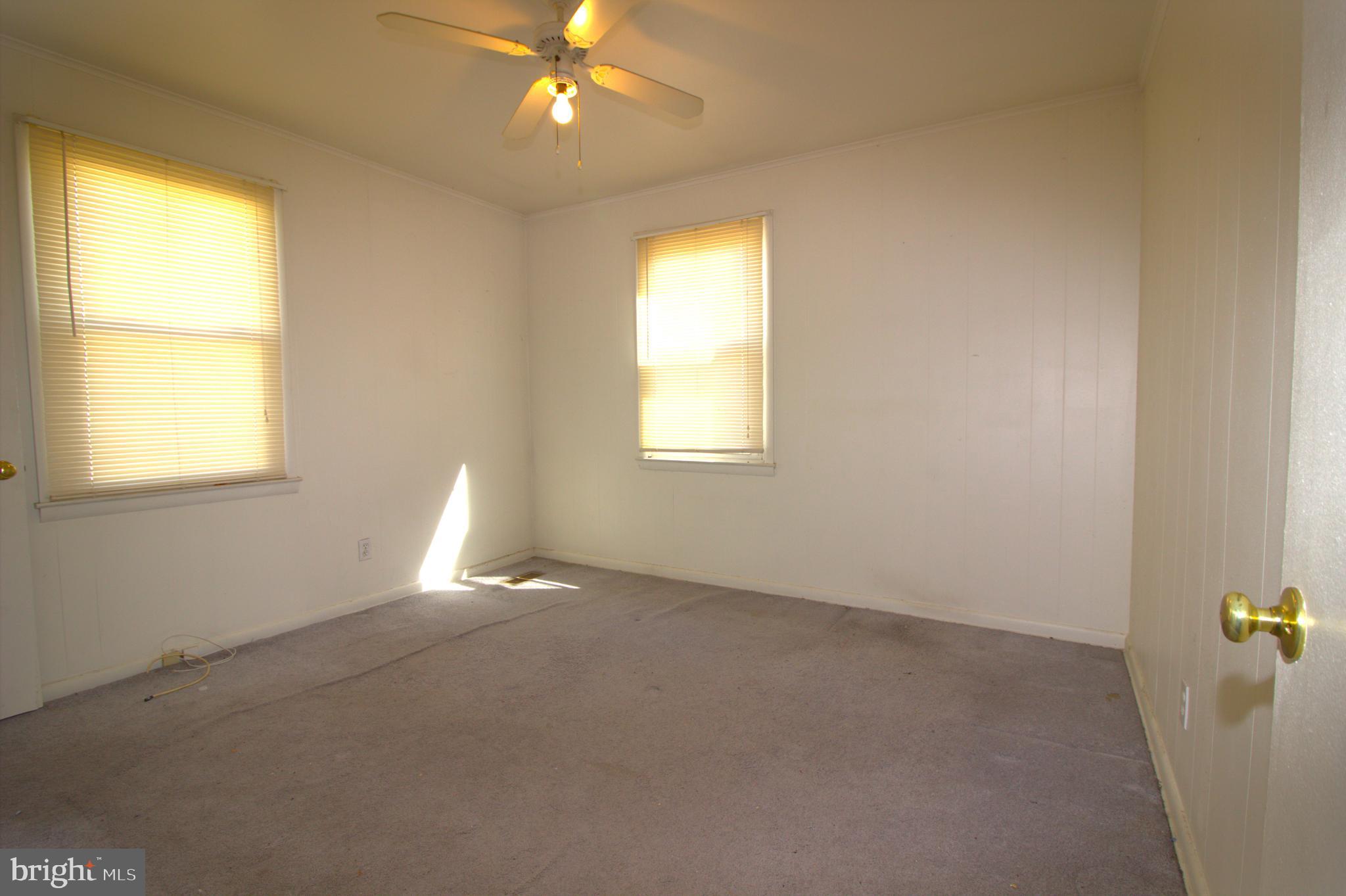 7613 Maple Road Baltimore, MD 21222 - Photo 21 of 32 a view of an empty room with a window