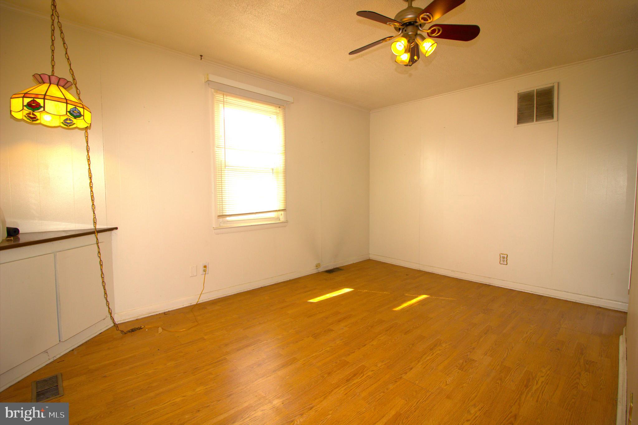 7613 Maple Road Baltimore, MD 21222 - Photo 24 of 32 a view of an empty room with a window