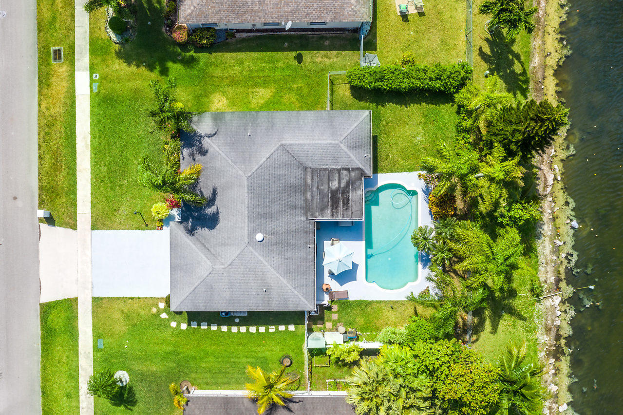 10921 Gable Street Boca Raton, FL 33428 - Photo 1 of 28 an aerial view of a house with swimming pool and garden