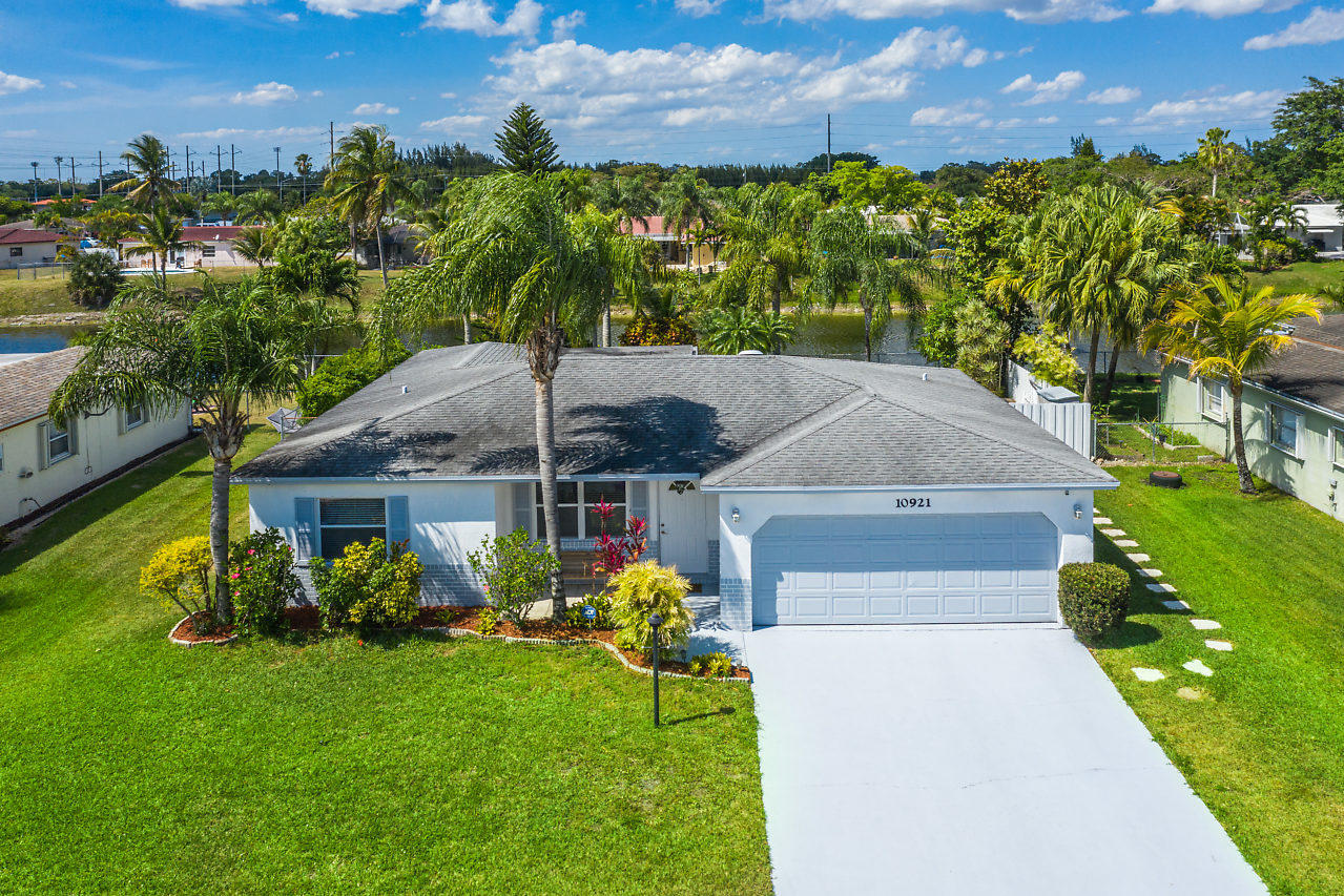 10921 Gable Street Boca Raton, FL 33428 - Photo 19 of 28 a front view of a house with garden