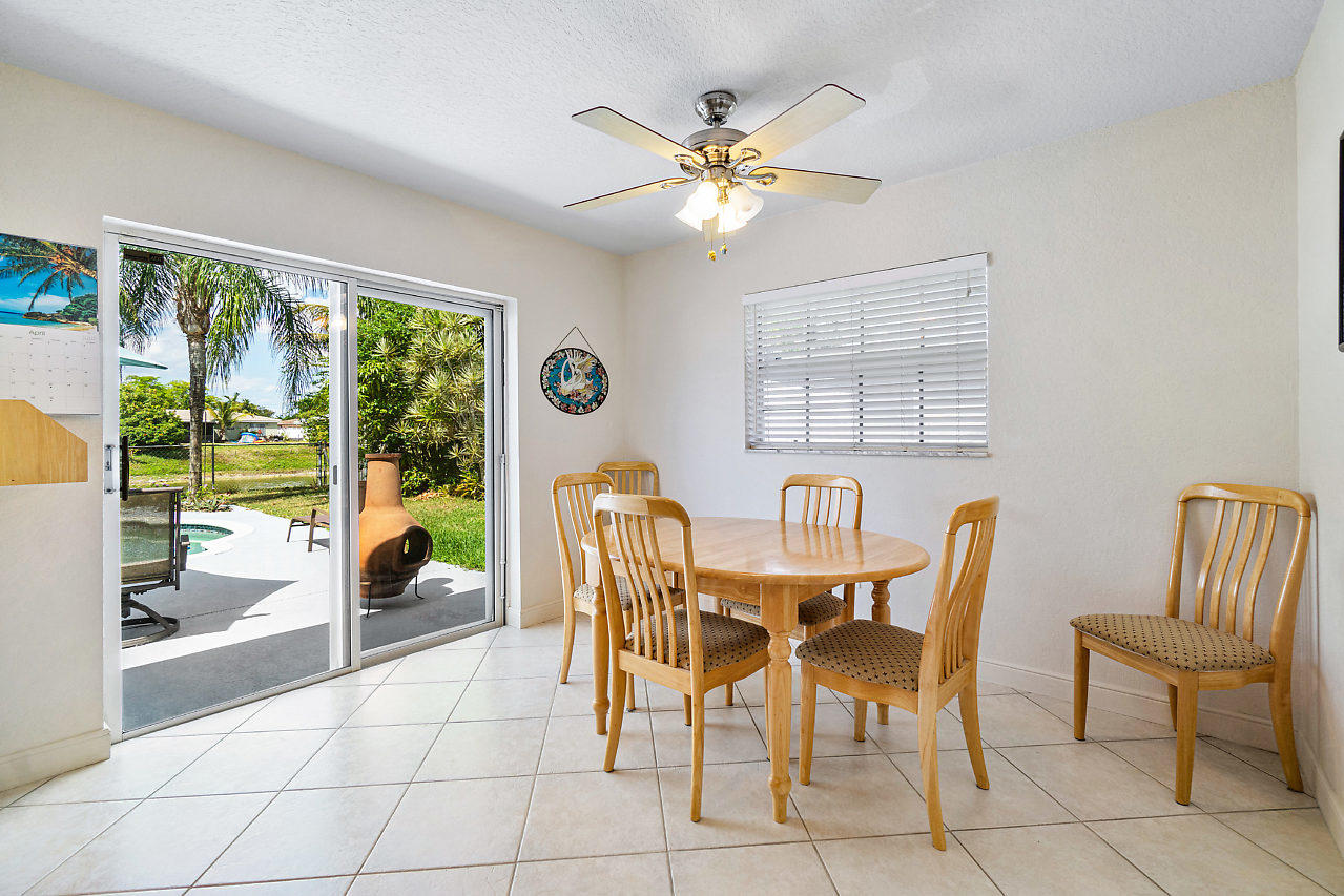 10921 Gable Street Boca Raton, FL 33428 - Photo 5 of 28 a dining room with furniture and window