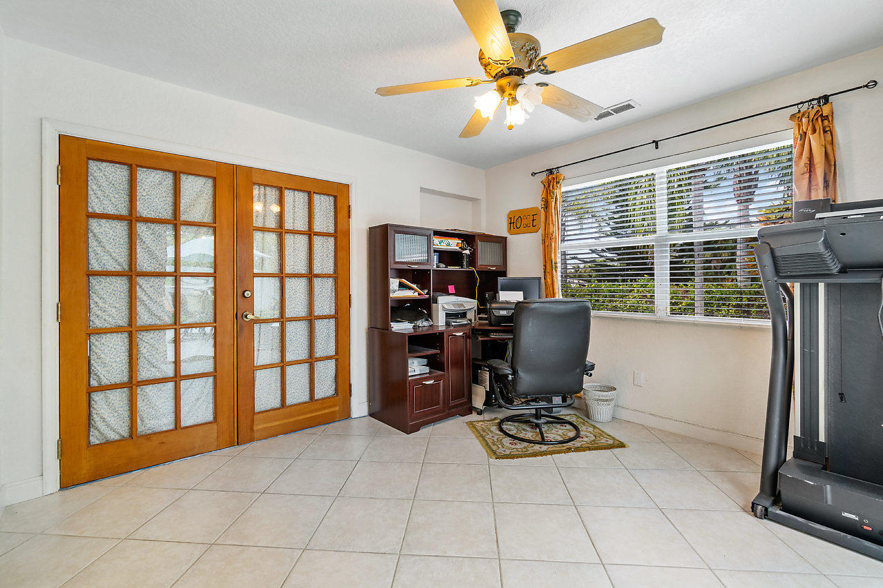 10921 Gable Street Boca Raton, FL 33428 - Photo 9 of 28 a view of a workspace with furniture and a window