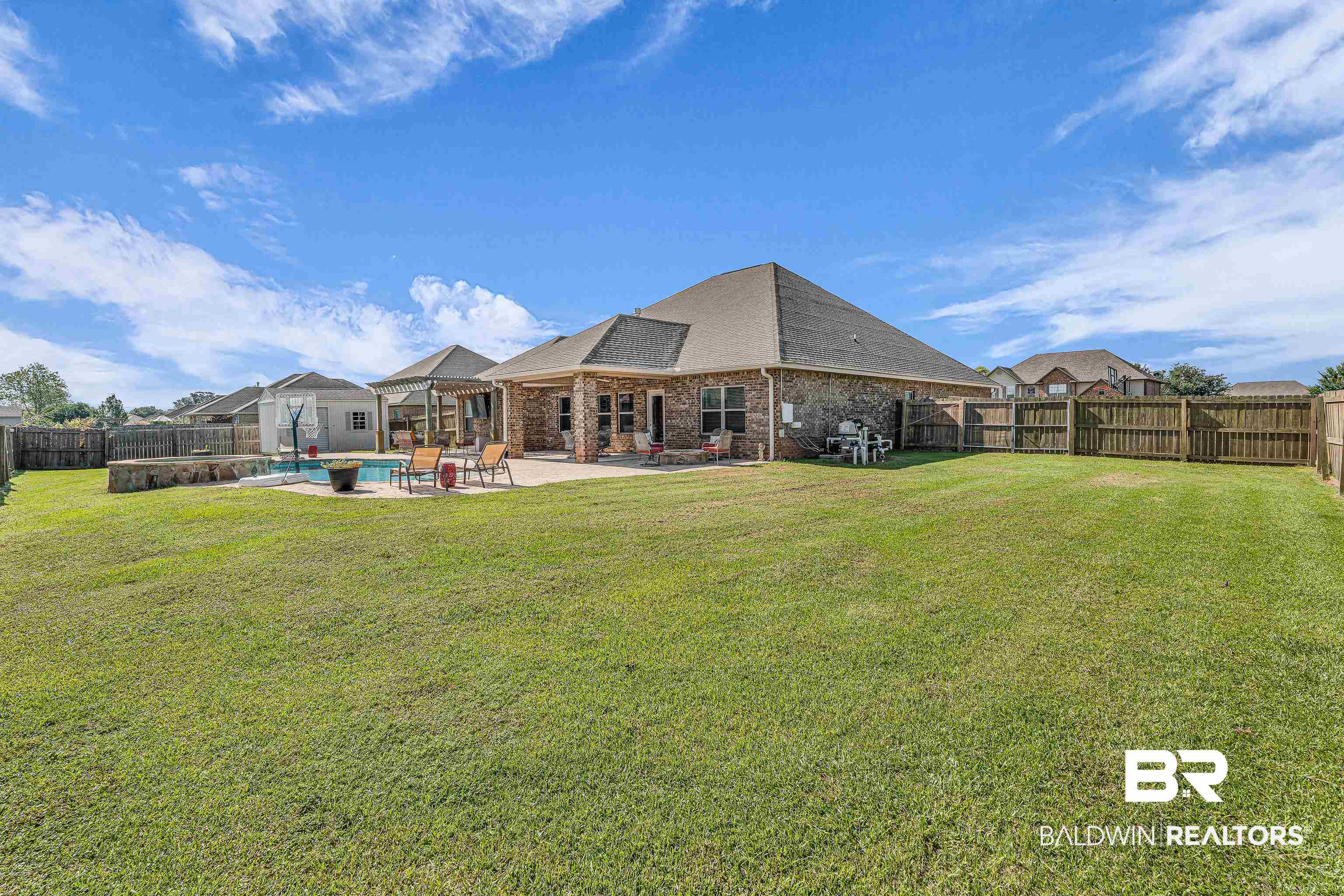 9675 Camberwell Drive Daphne, AL 36526 - Photo 32 of 34 Rear view of property featuring a fenced backyard, a patio area, brick siding, and a shingled roof
