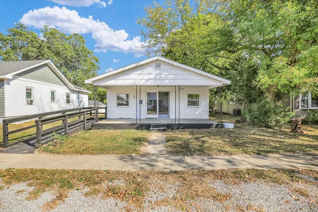a house with trees in the background