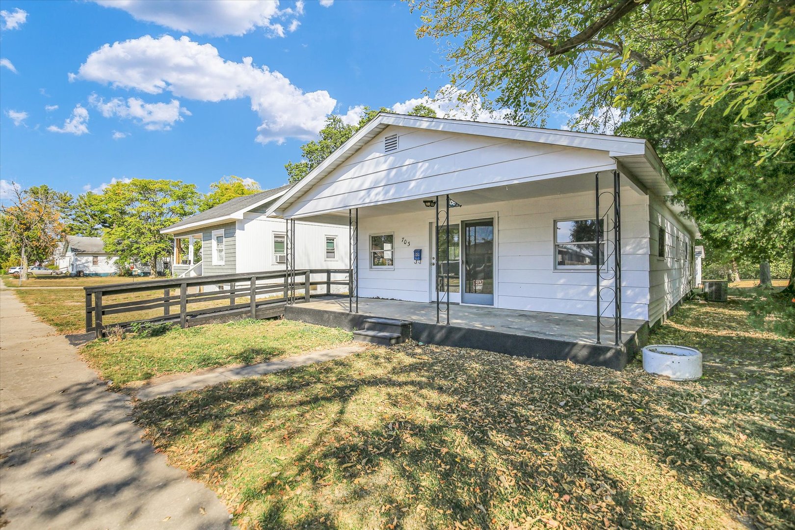 703 South Spruce Street Villa Grove, IL 61956 - Photo 12 of 28 a view of a house with backyard and sitting area