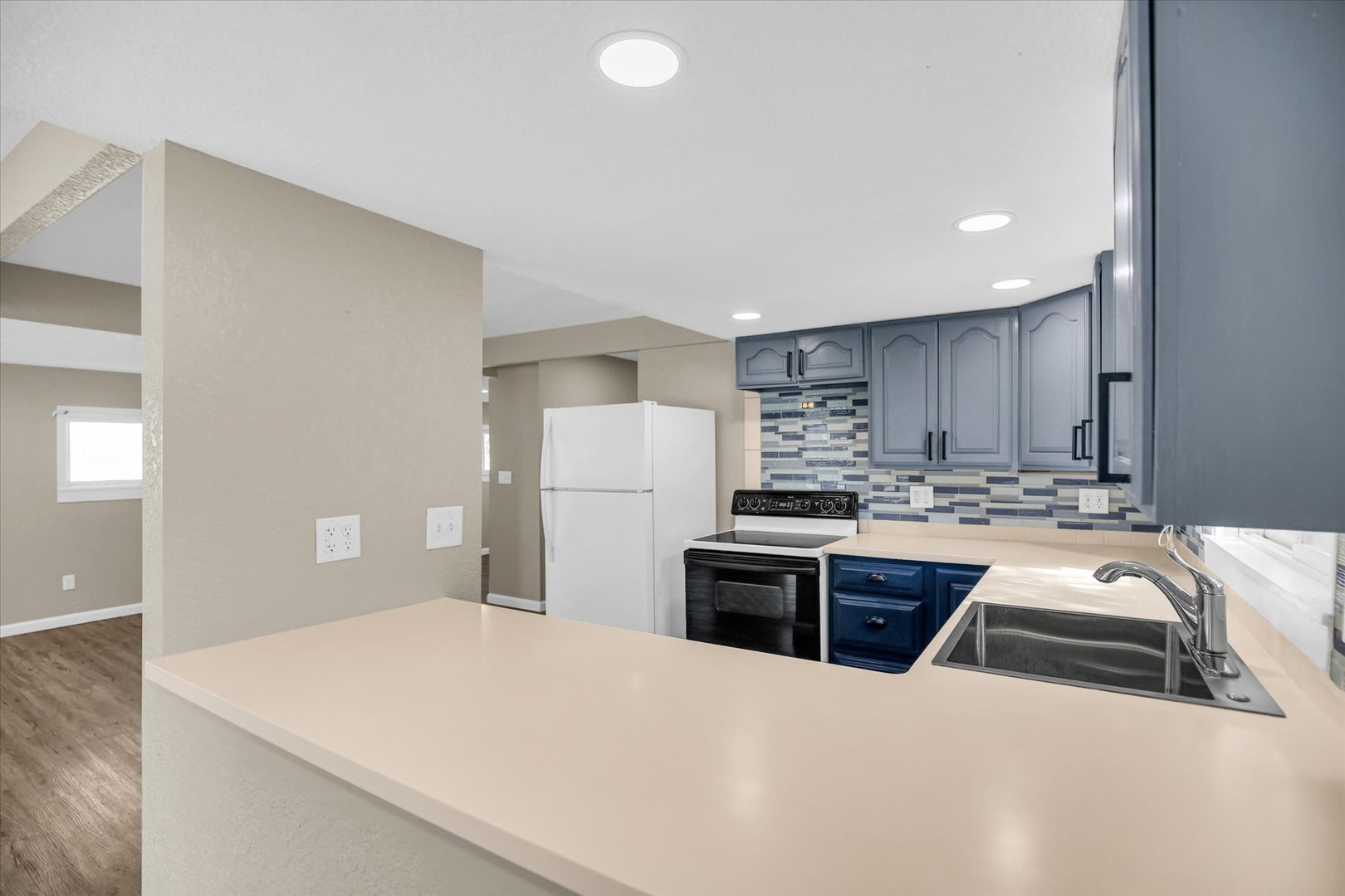 703 South Spruce Street Villa Grove, IL 61956 - Photo 19 of 28 a kitchen with kitchen island sink stove and refrigerator