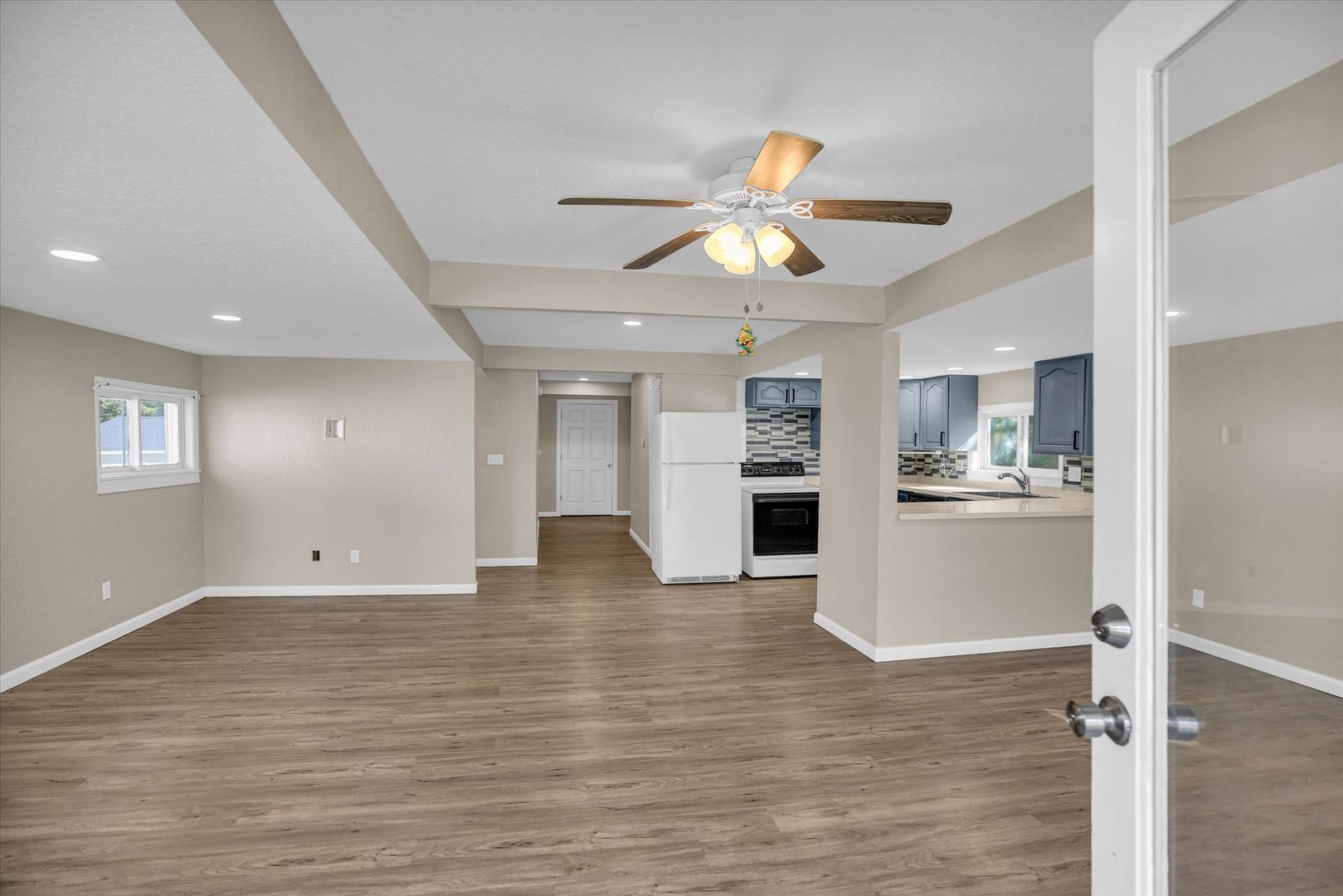 703 South Spruce Street Villa Grove, IL 61956 - Photo 2 of 28 a view of a kitchen with a sink and refrigerator