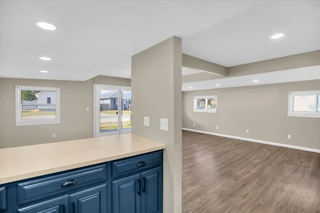 a view of kitchen with granite countertop cabinets and wooden floor