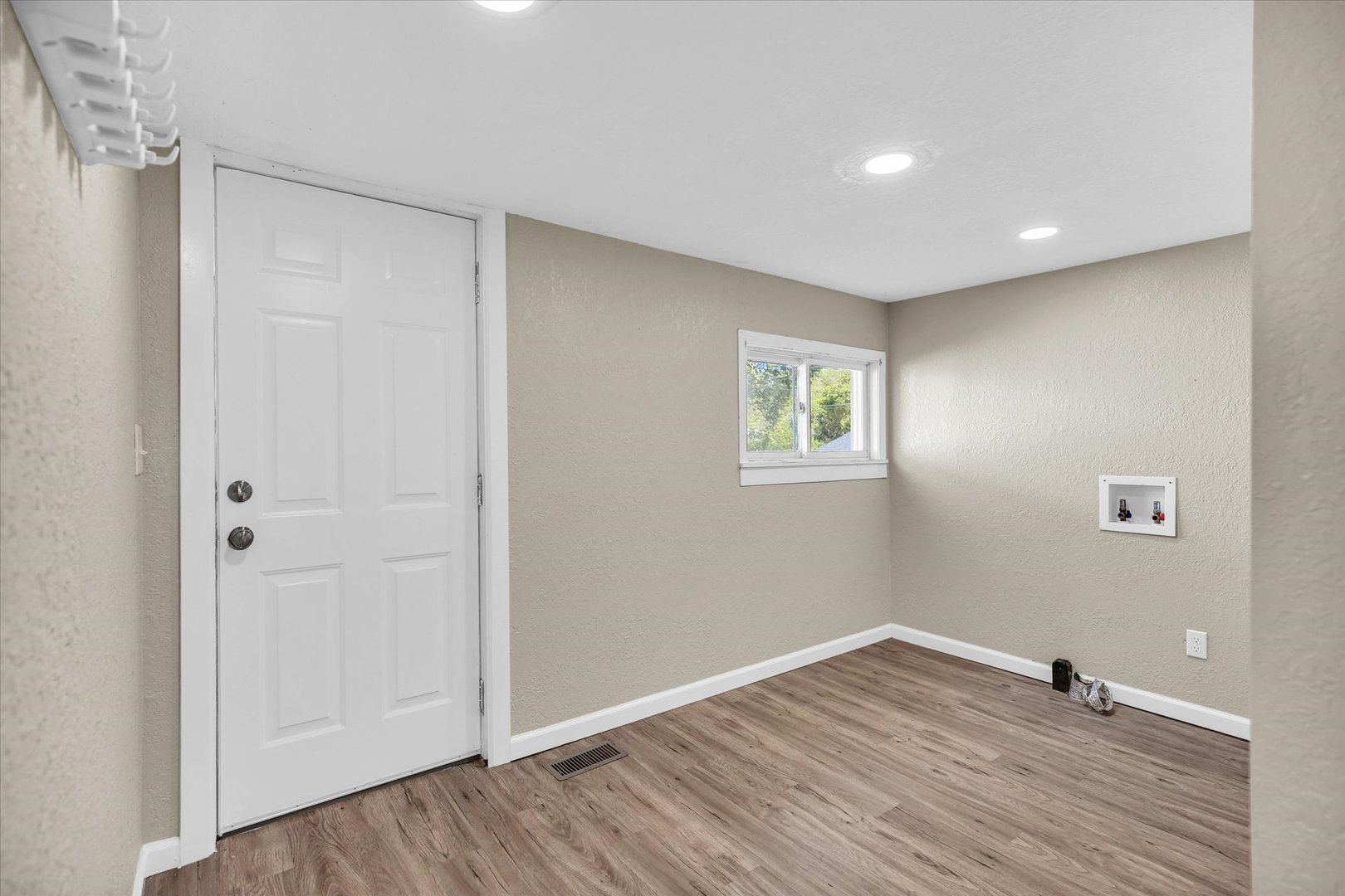 703 South Spruce Street Villa Grove, IL 61956 - Photo 24 of 28 a view of empty room with wooden floor
