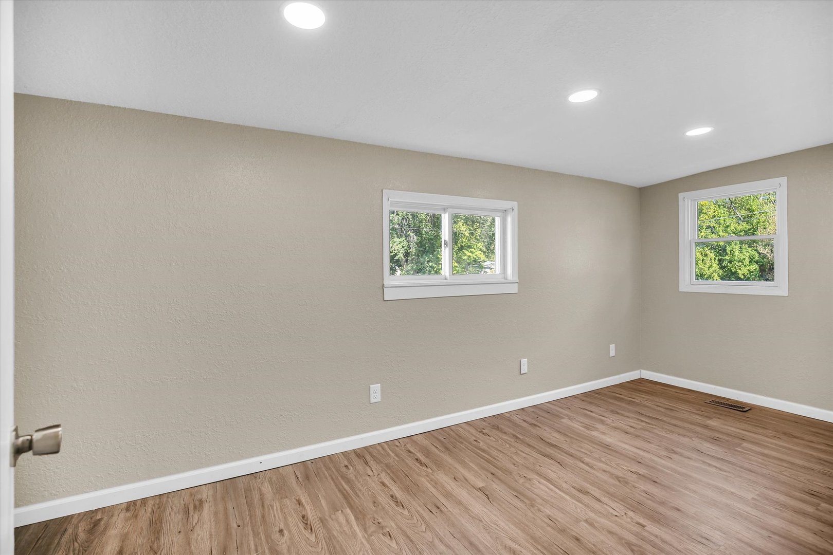 703 South Spruce Street Villa Grove, IL 61956 - Photo 25 of 28 wooden floor in an empty room with a window
