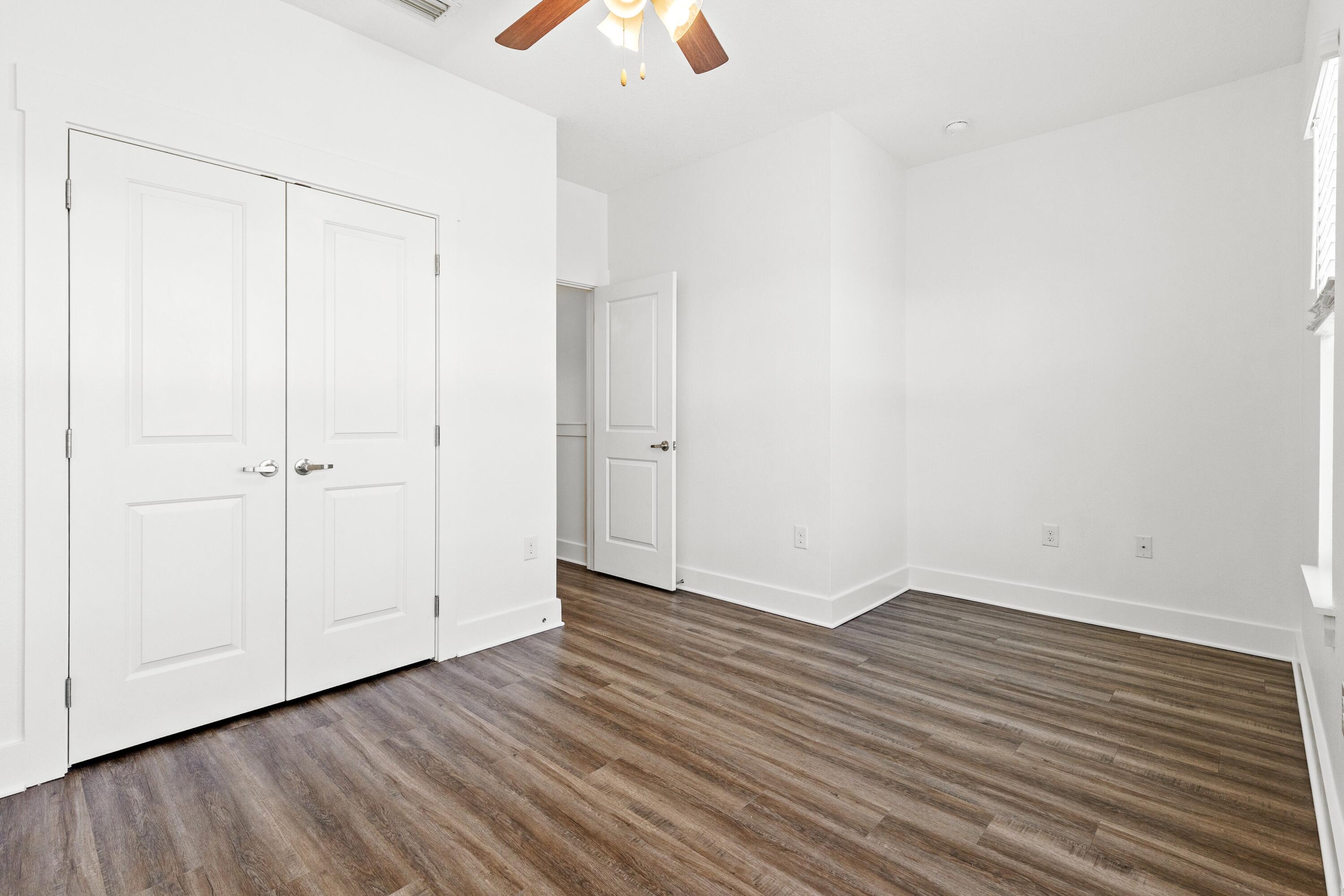 392 North Sand Palm Road Freeport, FL 32439 - Photo 15 of 36 a view of an empty room with wooden floor