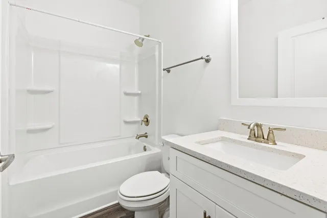 a bathroom with a sink a toilet and a bathtub