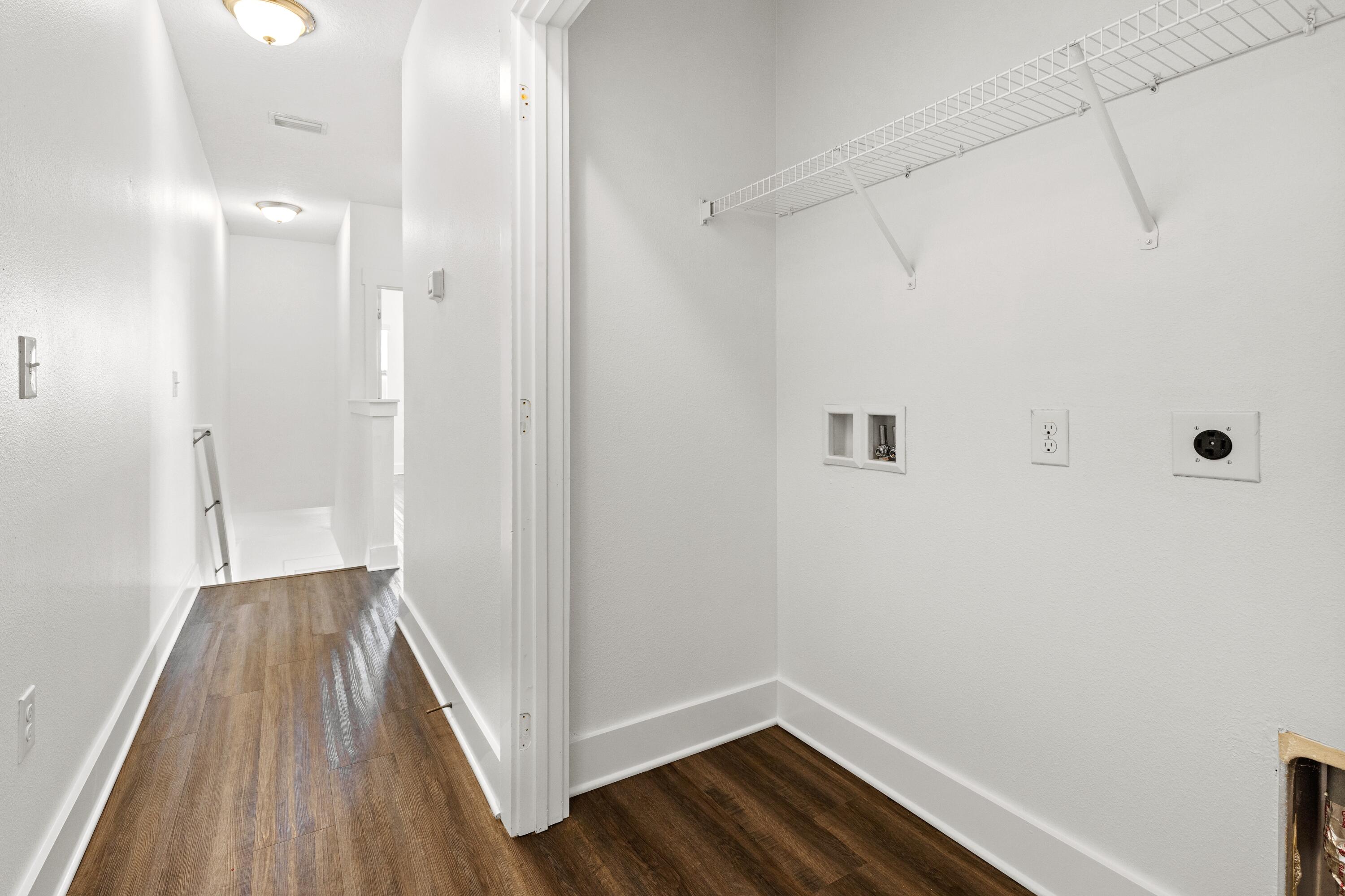 392 North Sand Palm Road Freeport, FL 32439 - Photo 18 of 36 a view of a hallway with wooden floor