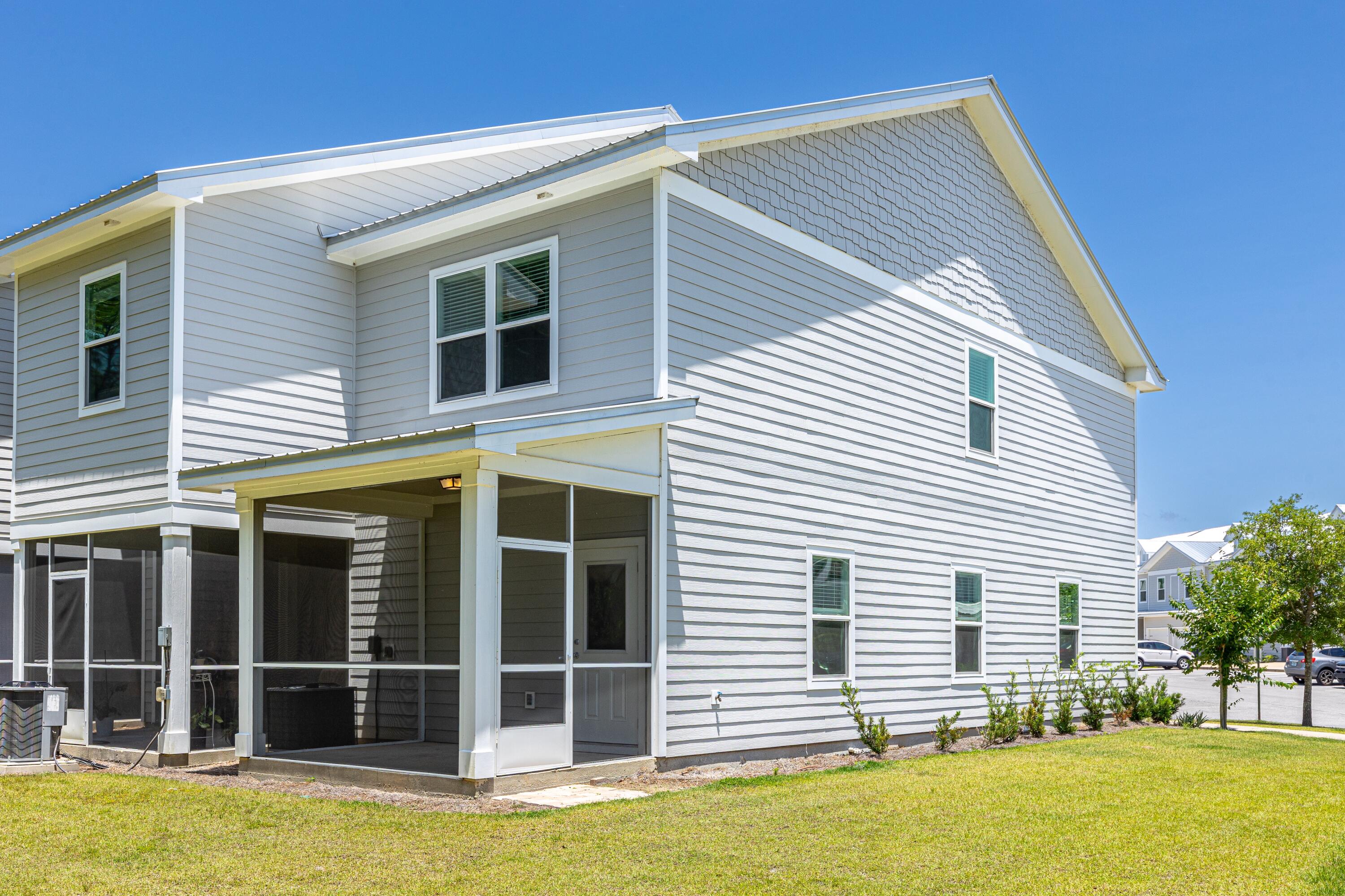 392 North Sand Palm Road Freeport, FL 32439 - Photo 20 of 36 a view of a house with a backyard