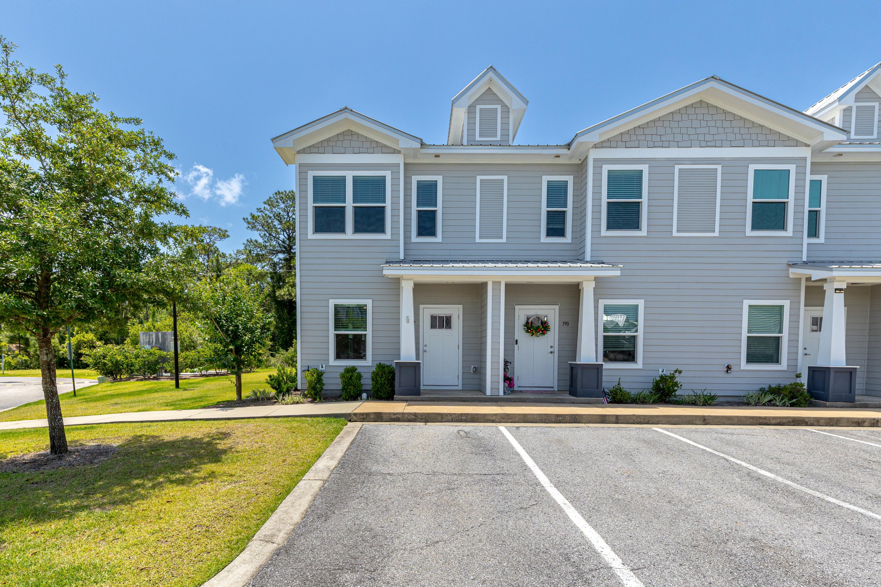 392 North Sand Palm Road Freeport, FL 32439 - Photo 2 of 36 a front view of a house with a yard