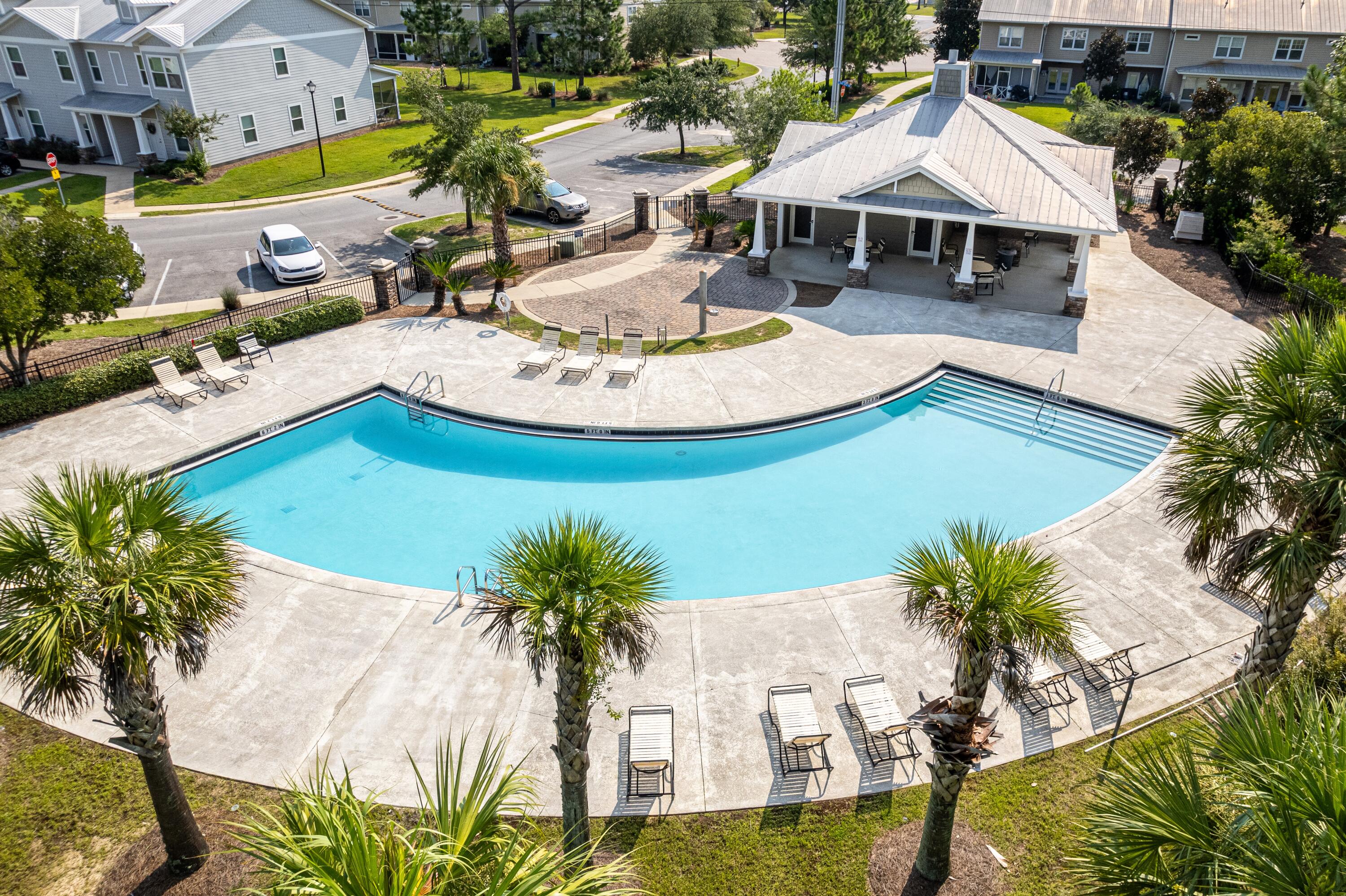 392 North Sand Palm Road Freeport, FL 32439 - Photo 21 of 36 a view of a house with pool and chairs