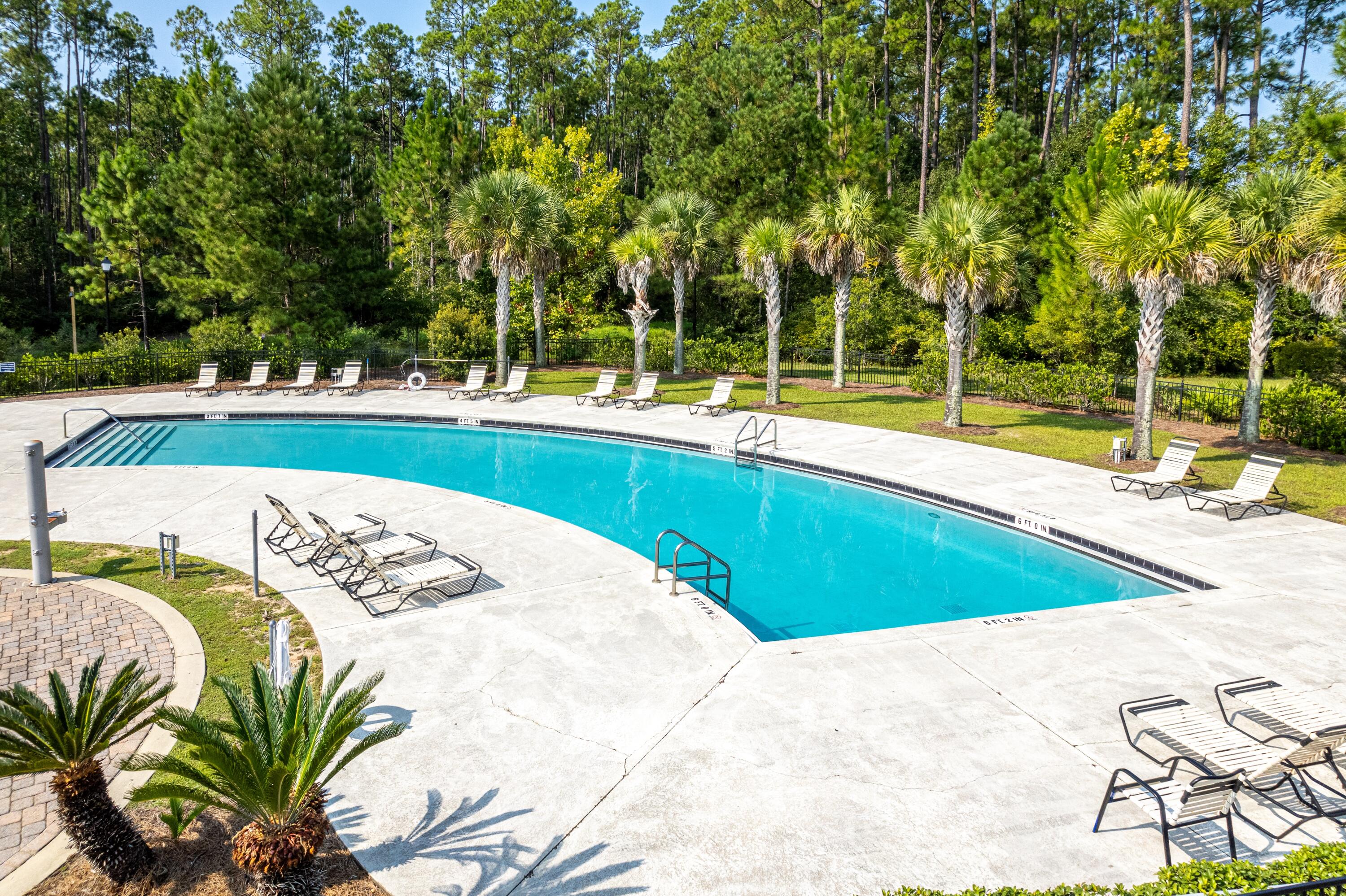 392 North Sand Palm Road Freeport, FL 32439 - Photo 22 of 36 a view of a swimming pool with a patio