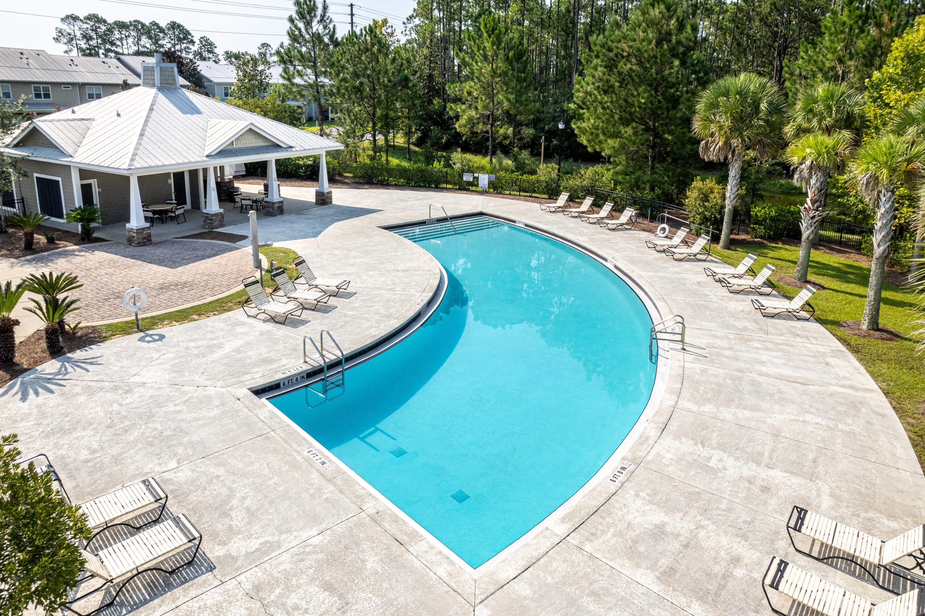 392 North Sand Palm Road Freeport, FL 32439 - Photo 23 of 36 an outdoor space with swimming pool and furniture