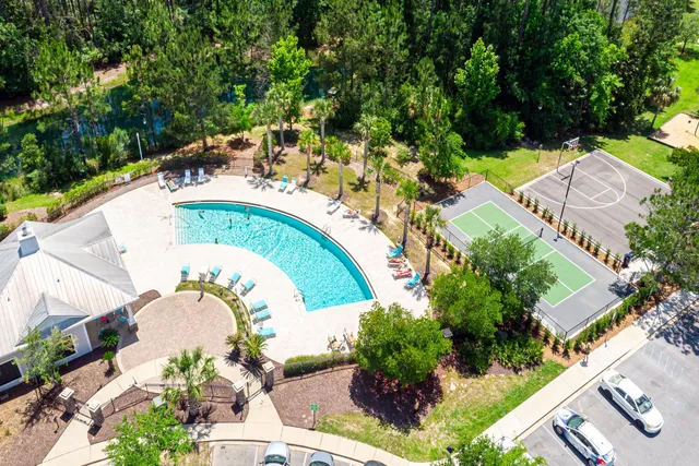 an aerial view of a house with a swimming pool
