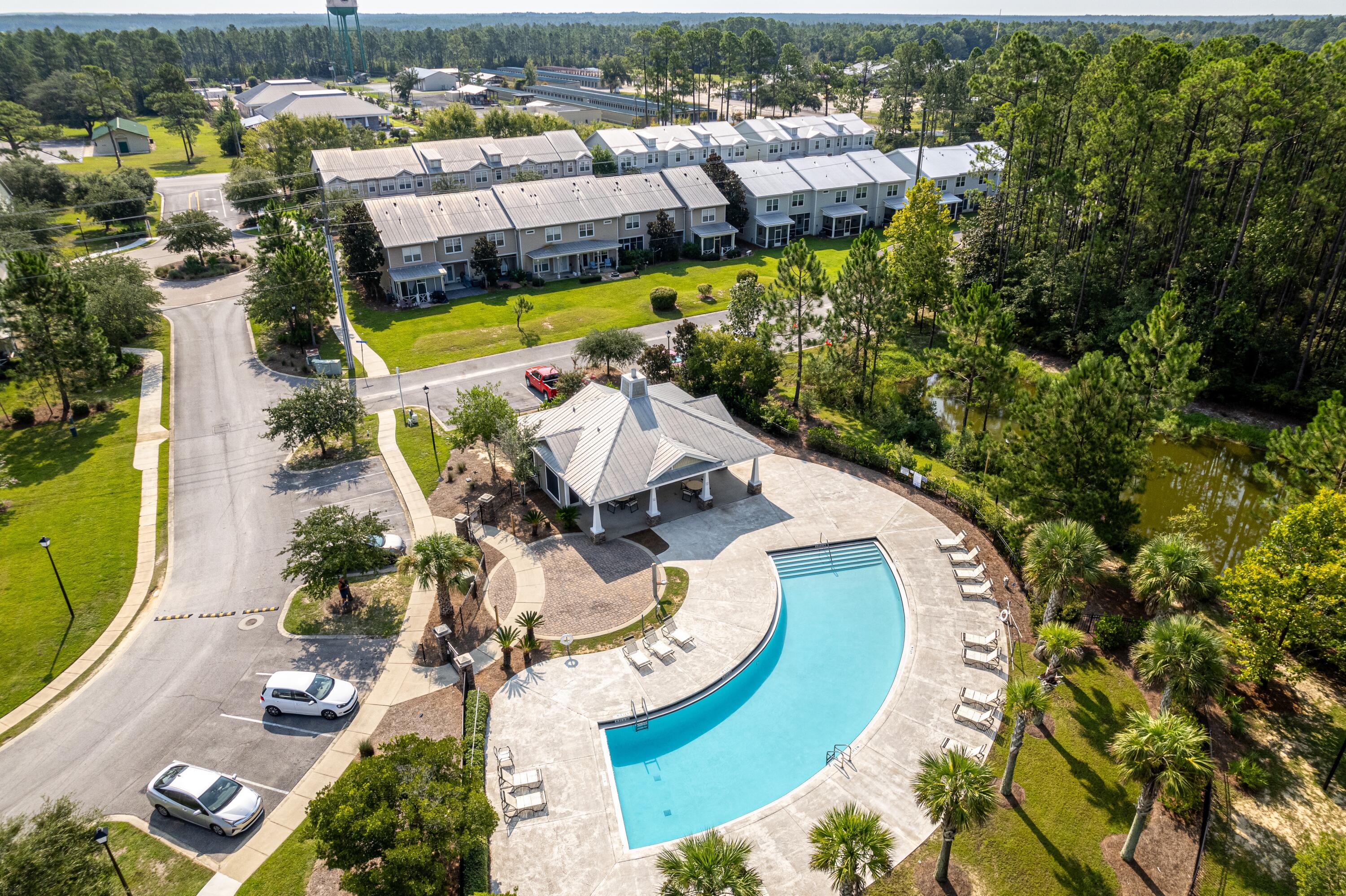 392 North Sand Palm Road Freeport, FL 32439 - Photo 26 of 36 an aerial view of a house with a swimming pool outdoor seating and yard