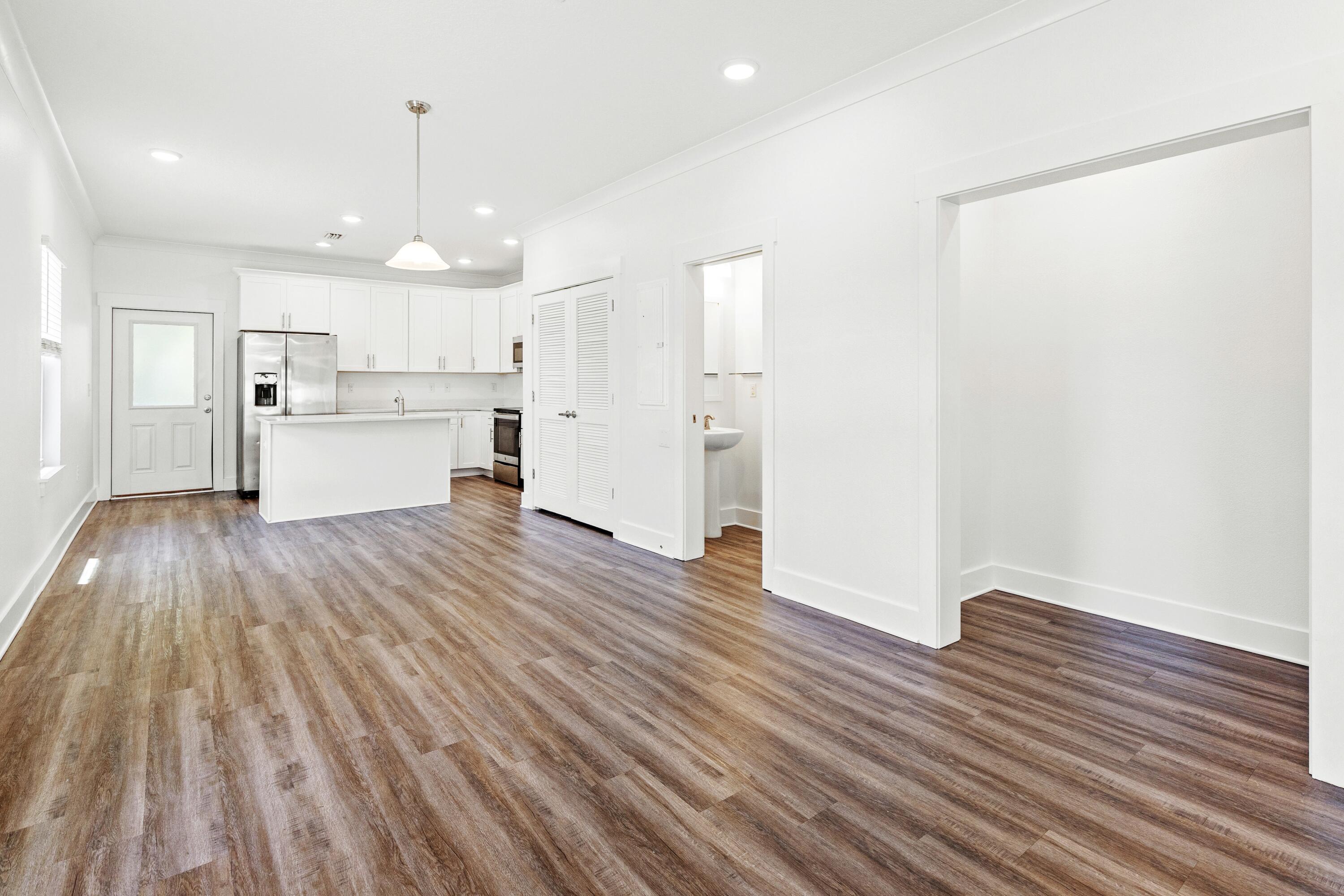 392 North Sand Palm Road Freeport, FL 32439 - Photo 7 of 36 a view of kitchen view wooden floors appliances and cabinets