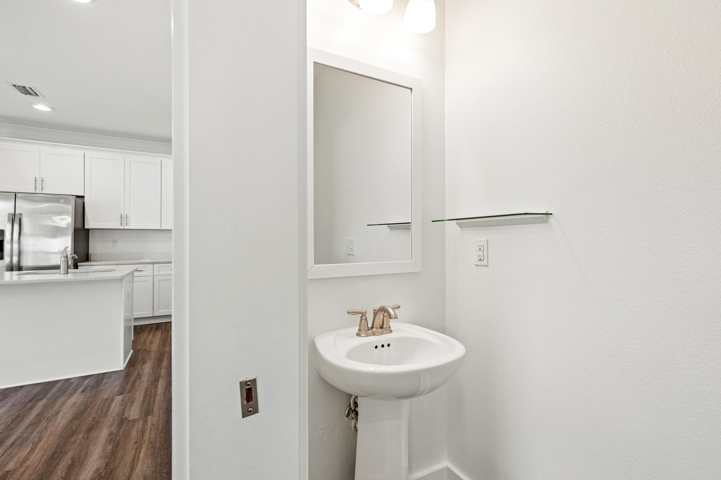 392 North Sand Palm Road Freeport, FL 32439 - Photo 10 of 36 a bathroom with a sink and a mirror